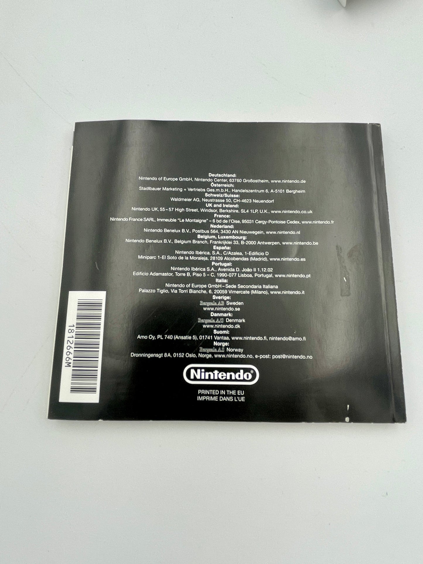 Black Nintendo package with text and barcode on a white background