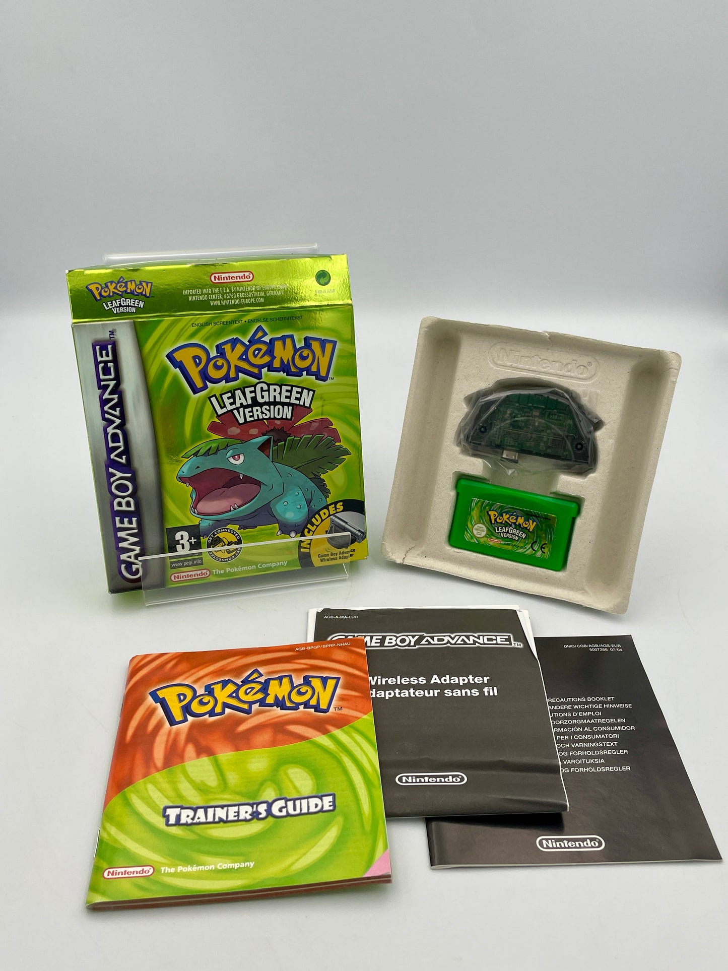 Pokémon Game Boy Advance game with accessories on a white background