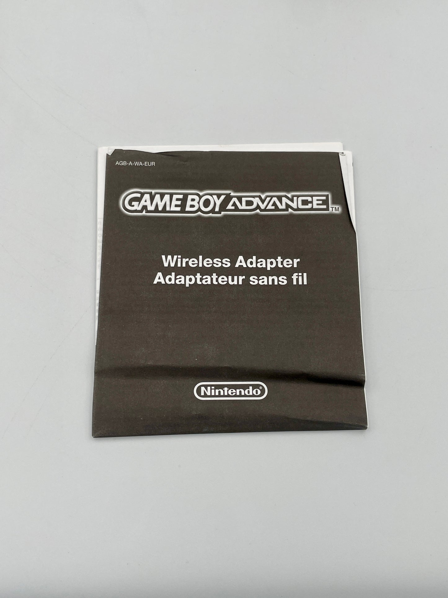 Nintendo Game Boy Advance Wireless Adapter packaging on a gray background