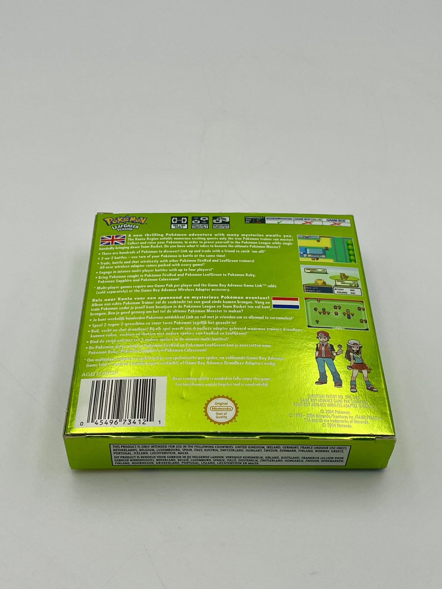 Back view of a green toy box with text and graphics on a white background