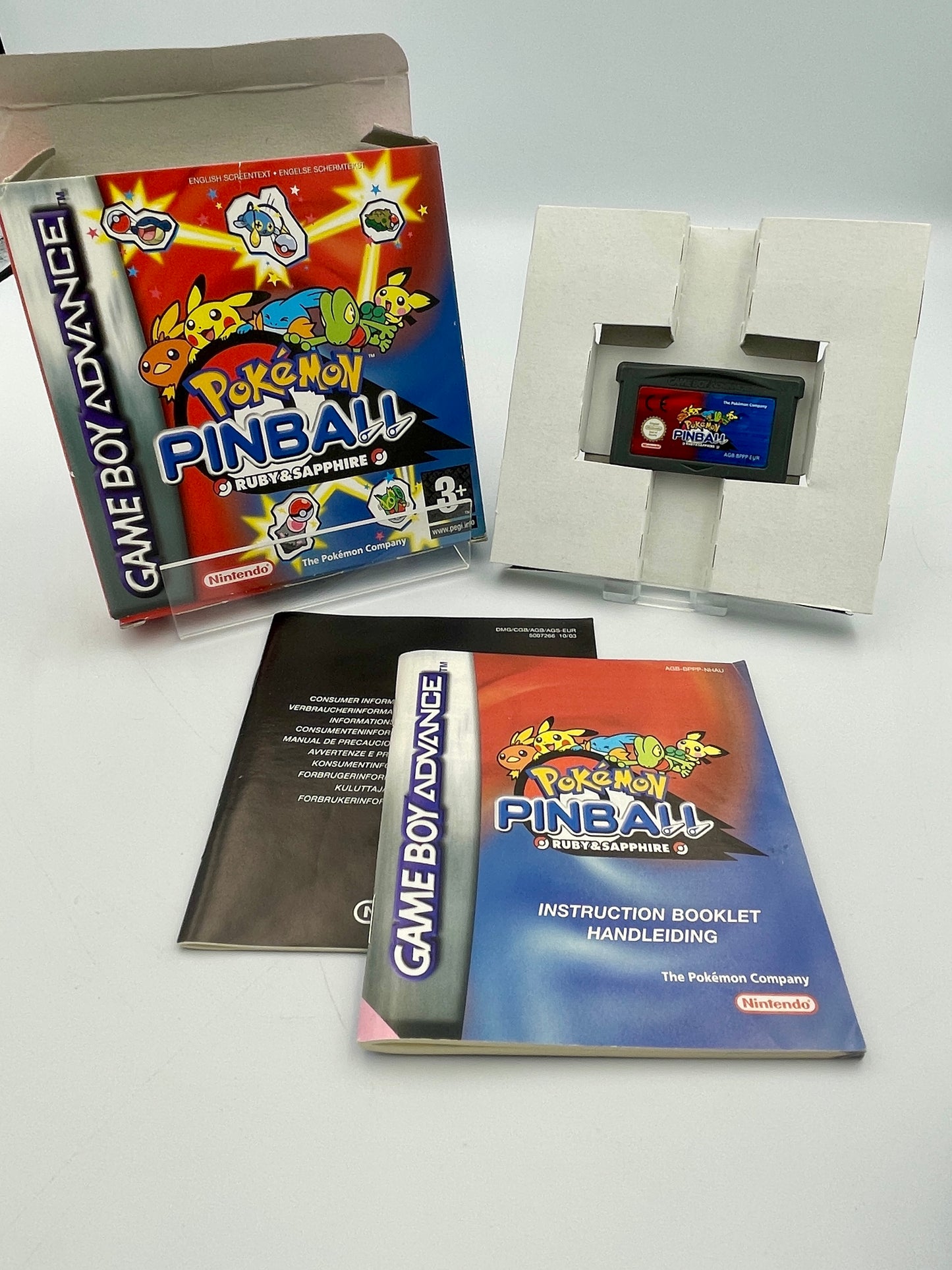 Pokémon Pinball Game Boy Advance game cartridge with manual and box on a white background