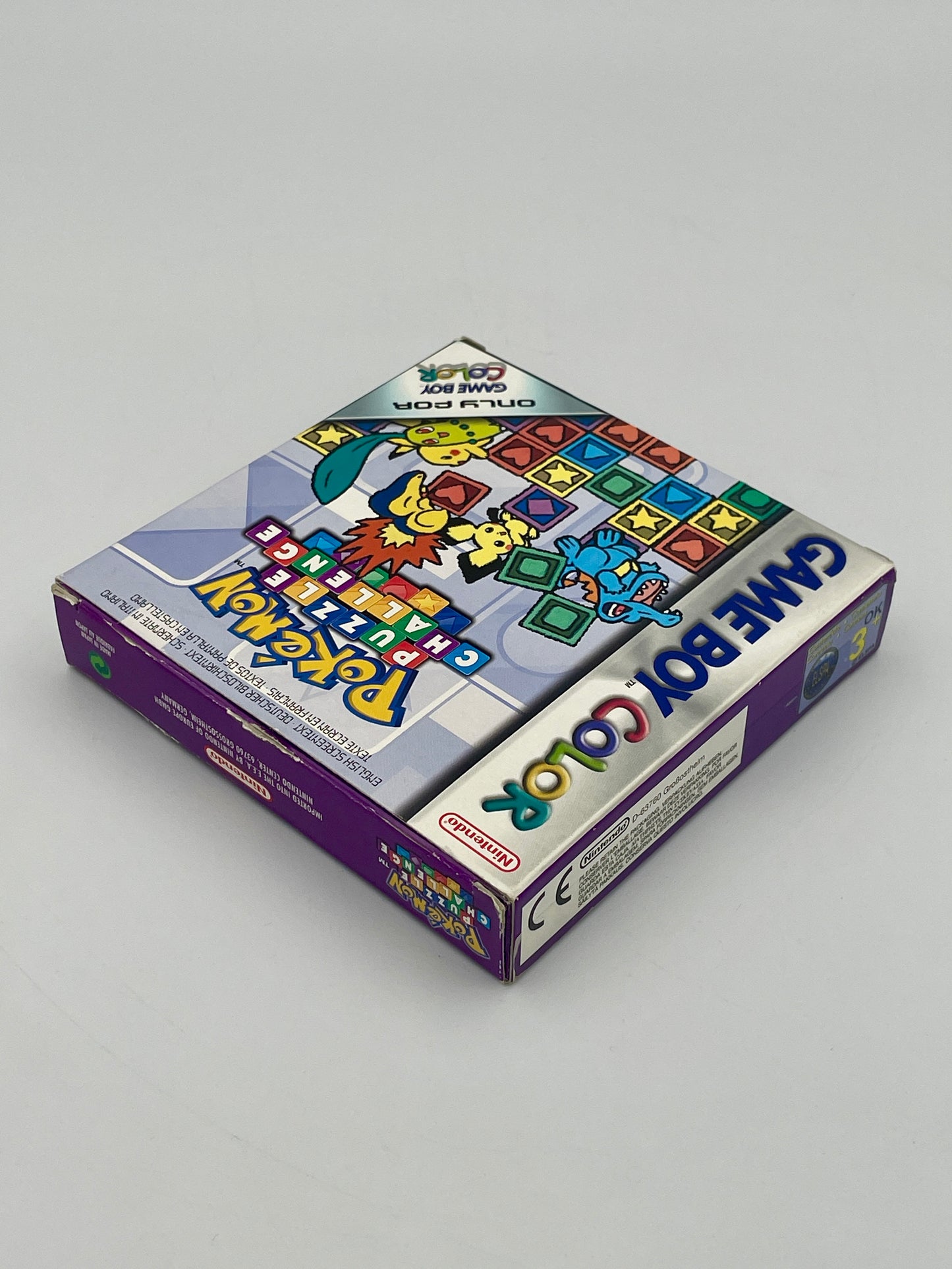 Board game box with colorful graphics on a gray background