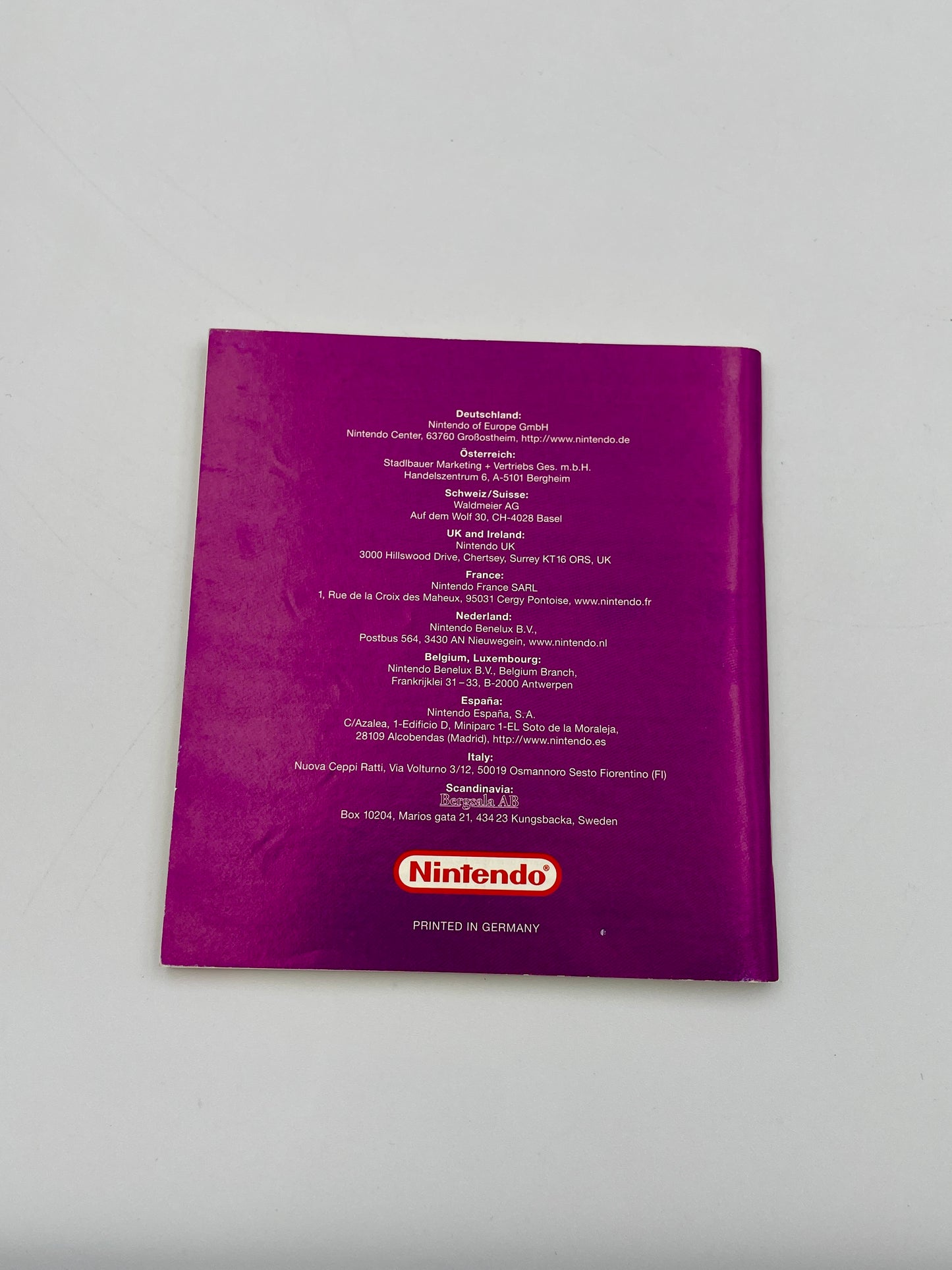 Purple Nintendo product packaging with text and logo on a white background