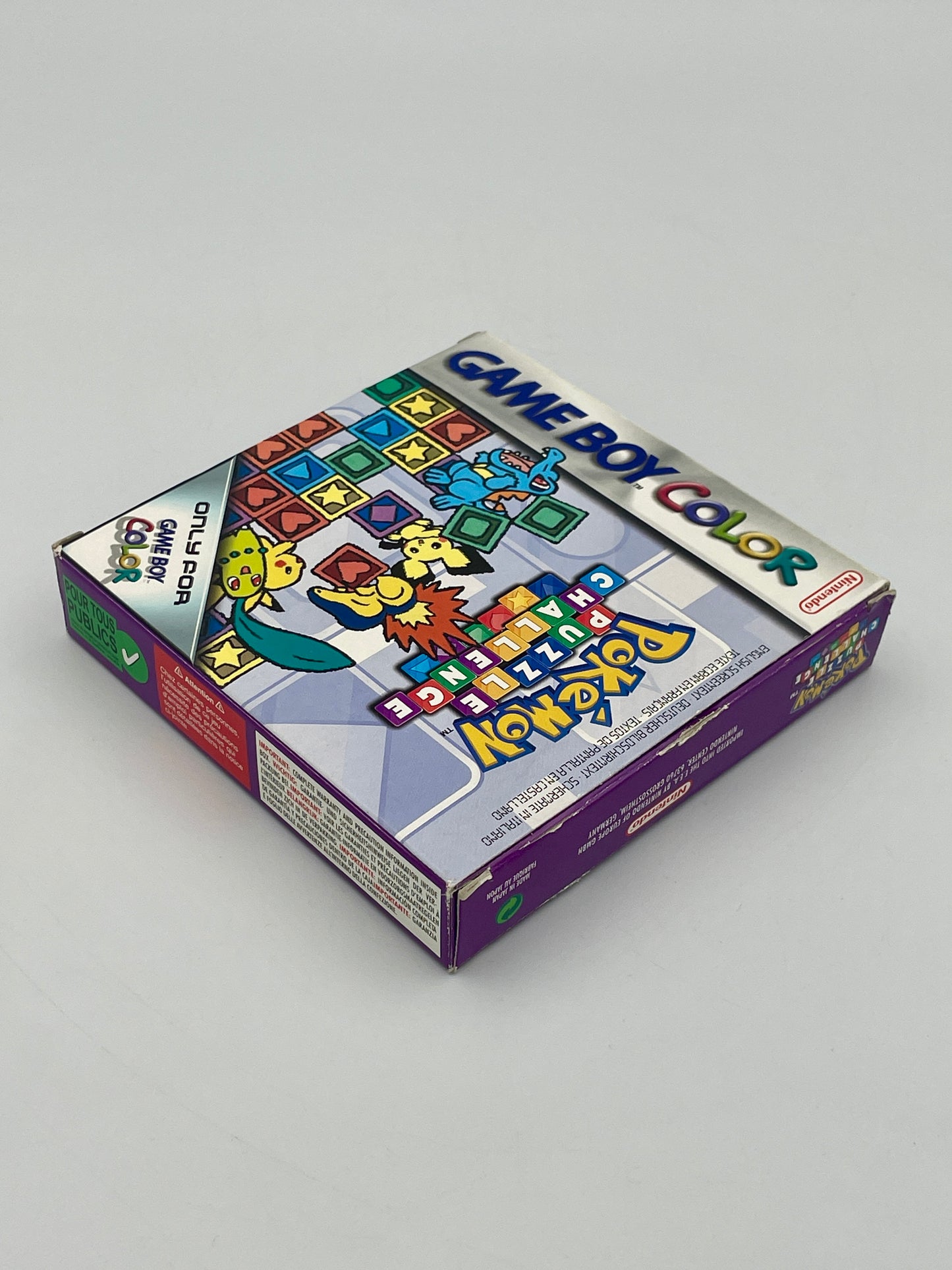 Game Boy Color game case with colorful graphics on a gray background