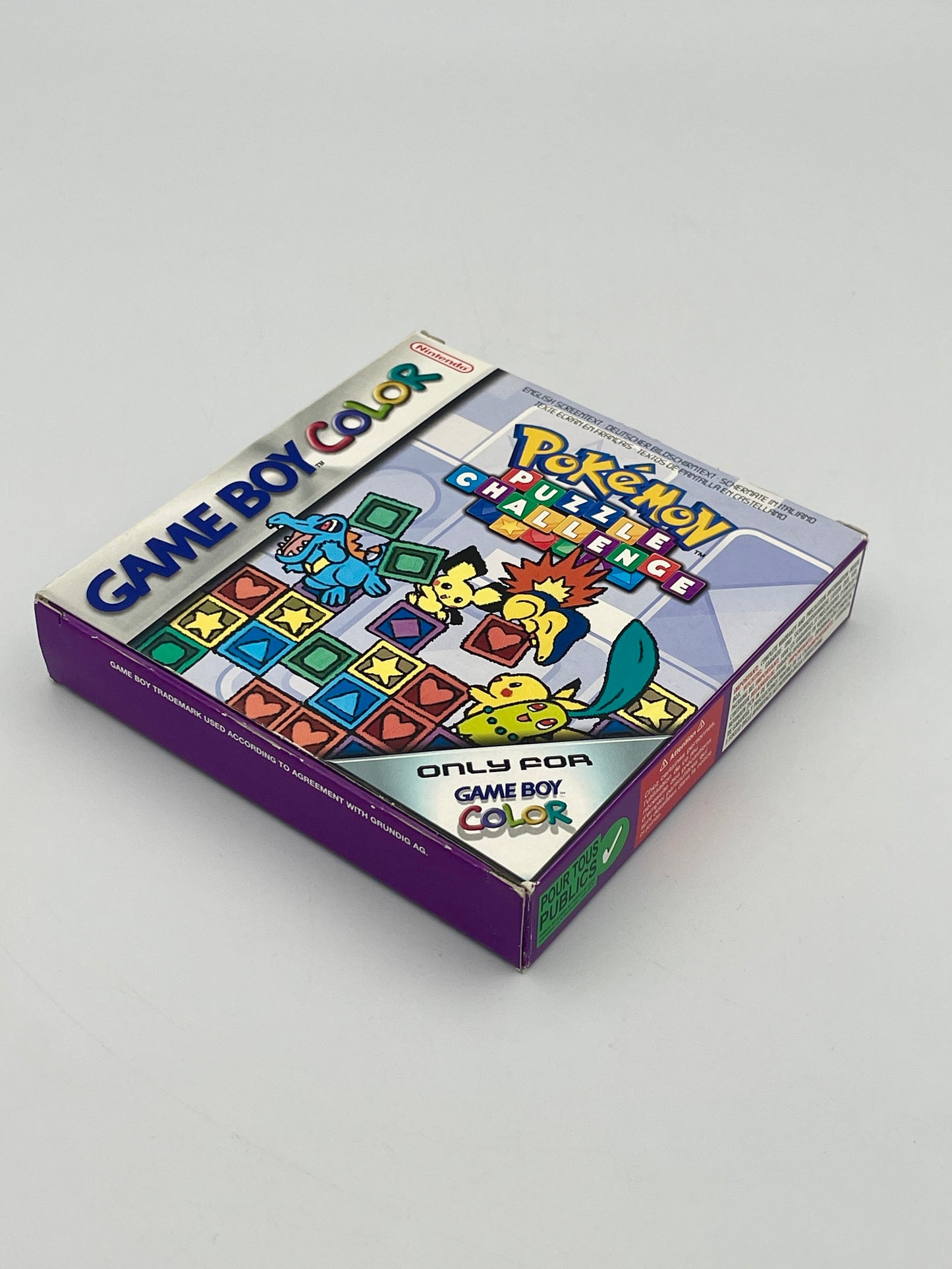 Pokémon Game Boy Color game case on a gray background