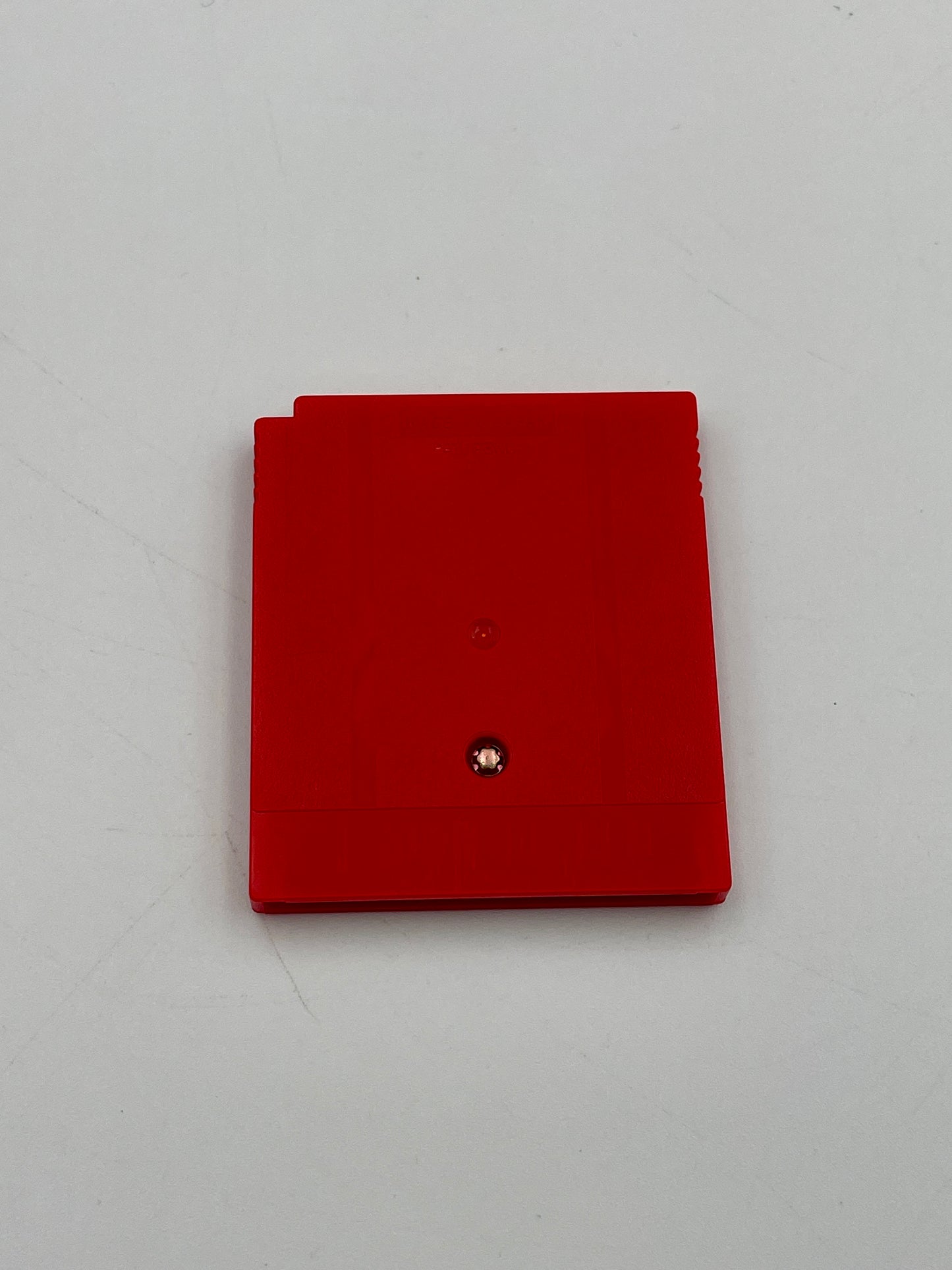 Red wallet with a brand logo on a light gray background