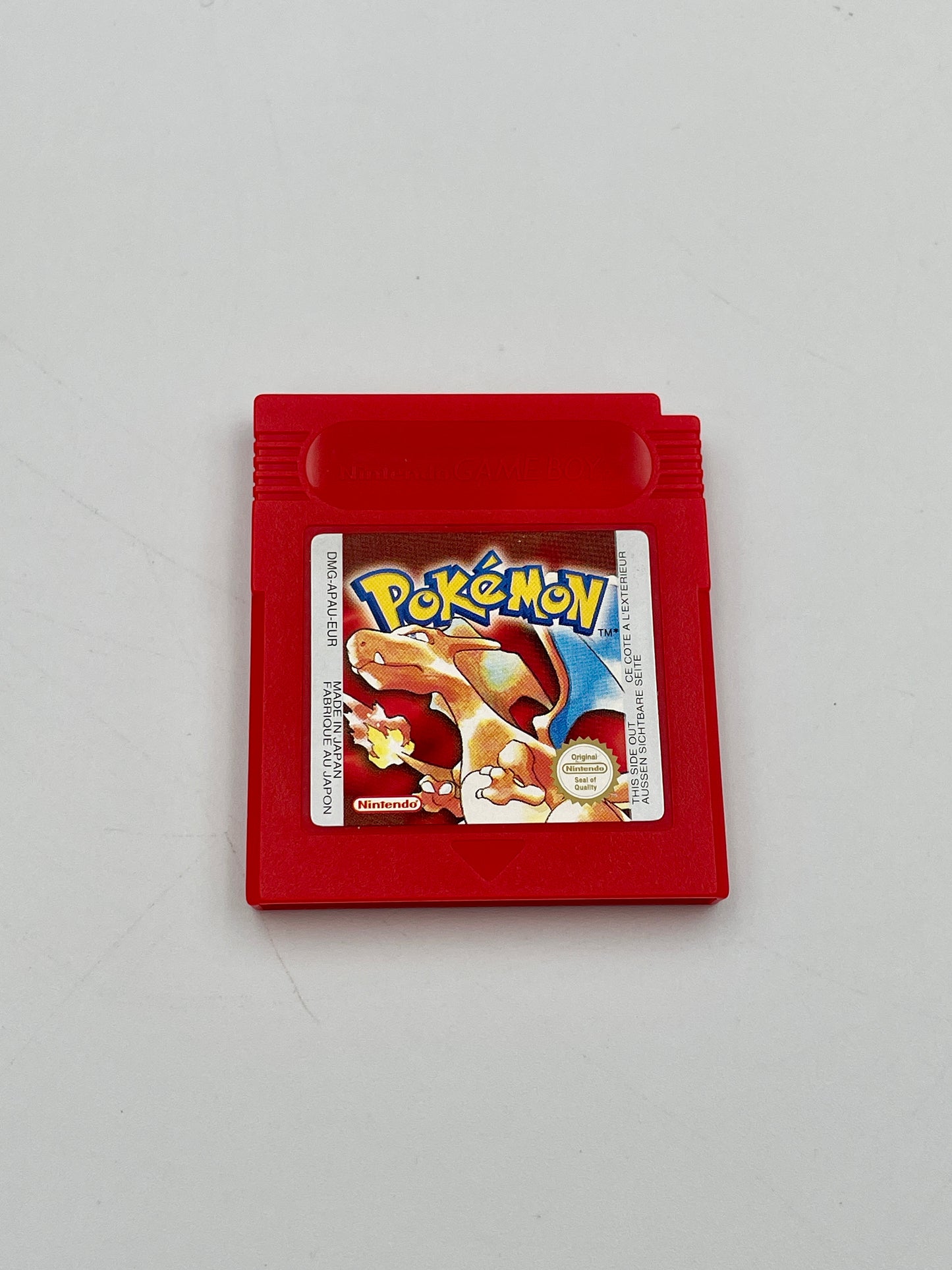 Red Game Boy cartridge with a Pokémon game on a white background