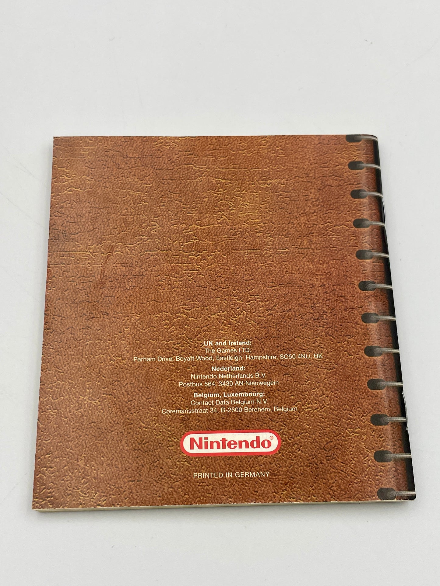 Brown notebook with Nintendo logo on a white background