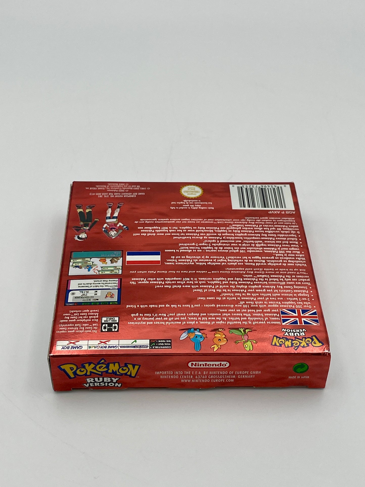Back view of a red Pokémon trading card game box on a white background