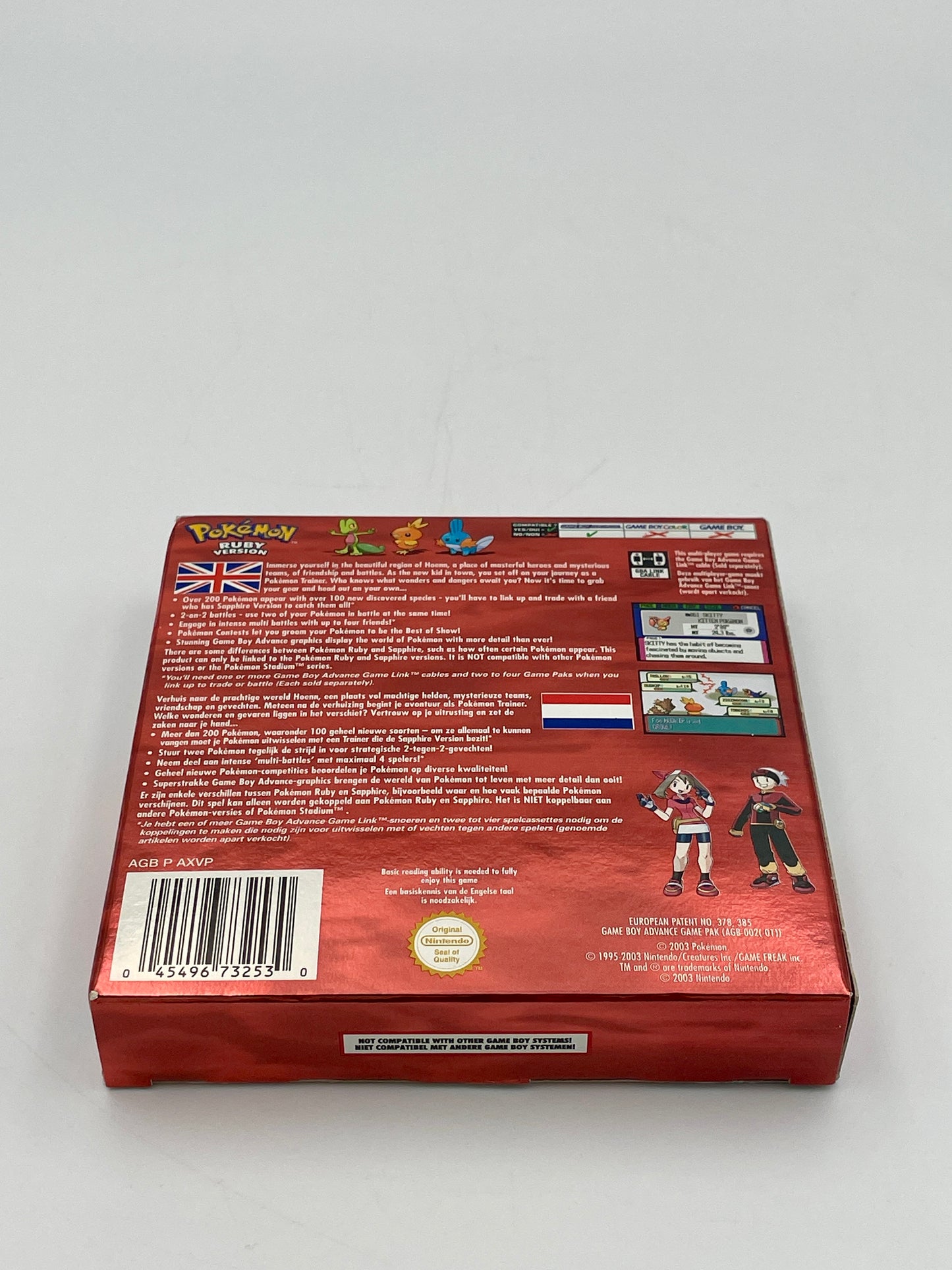 Back view of a red toy box with text and graphics on a gray background