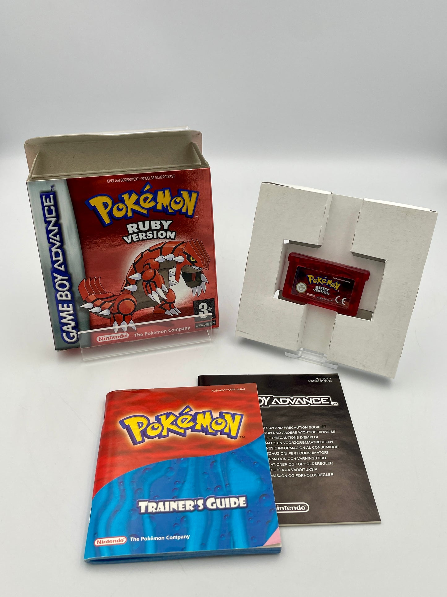 Pokémon Ruby Version Game Boy Advance game with manual and box on a white background