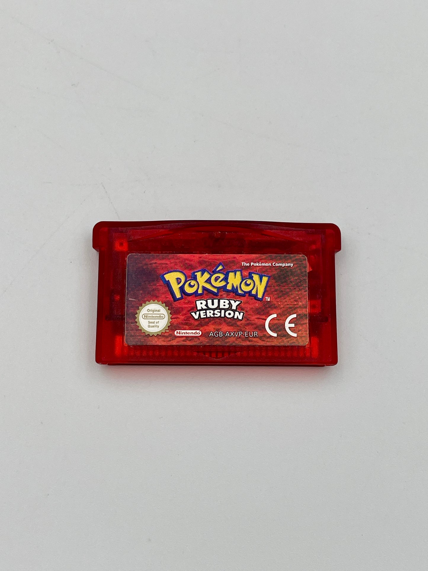 Red Game Boy cartridge with 'Pokémon Ruby Version' on a gray background
