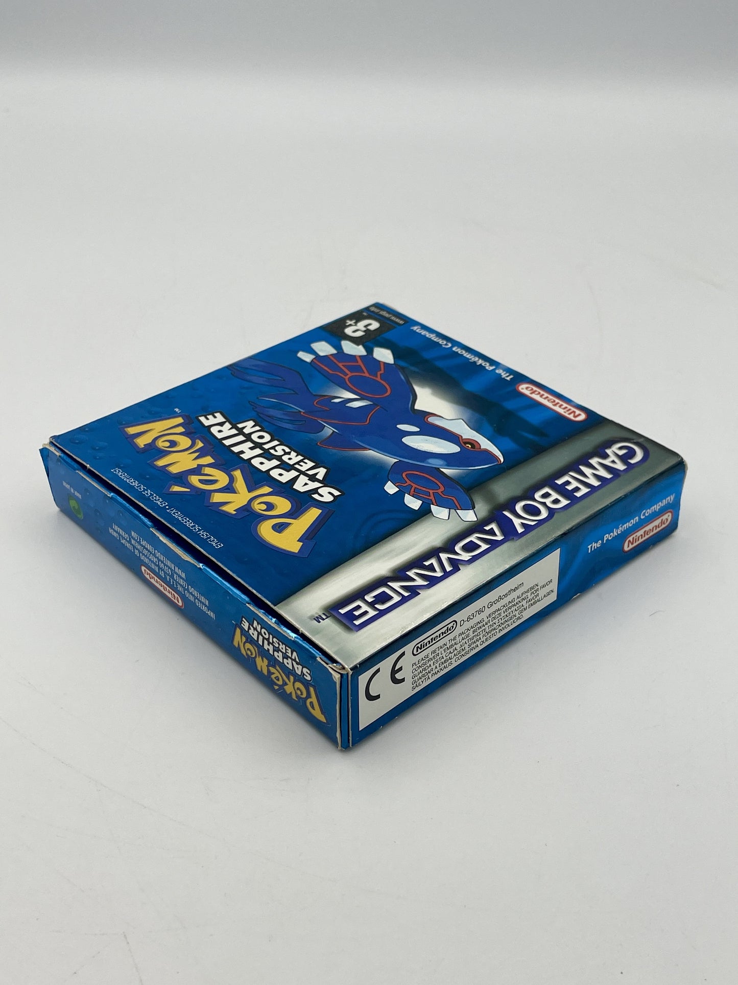 Game Boy Advance packaging with 'Pokémon' branding on a gray background