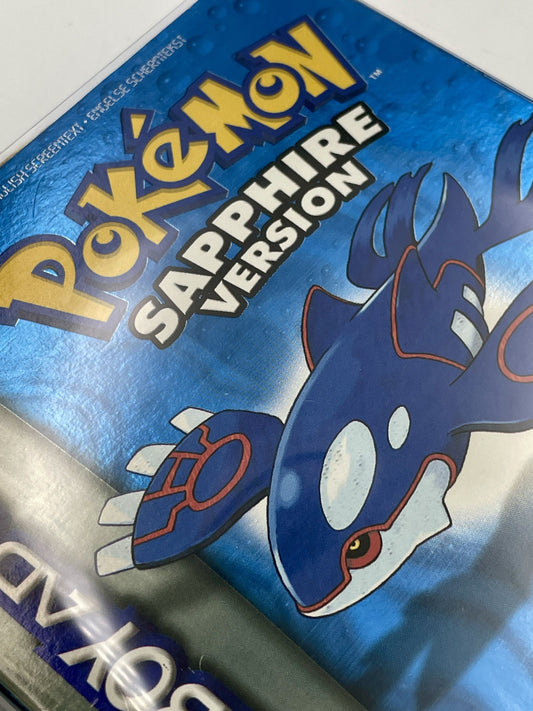 Pokémon Sapphire Version game case with a blue and yellow design.