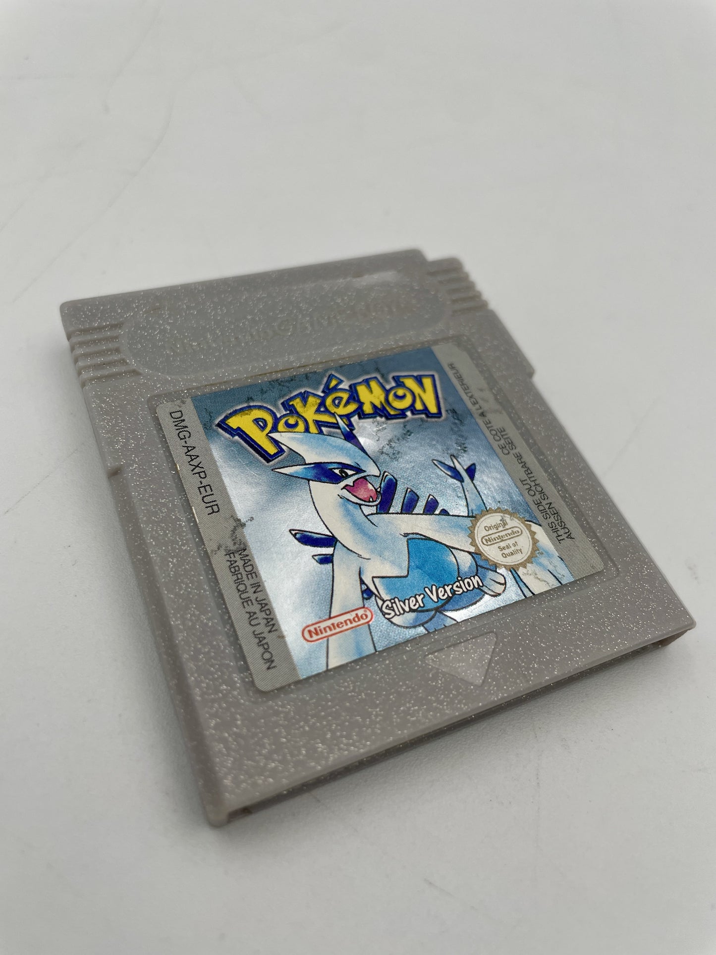 Gray Game Boy cartridge with a Pokémon Silver Version label on a white background