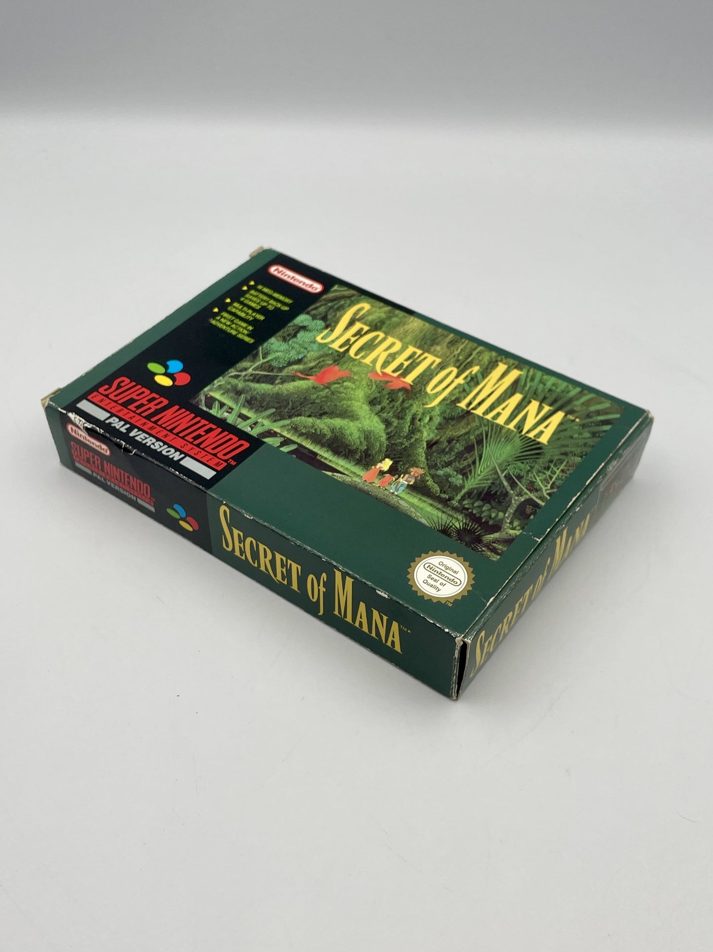 Box of 'Secret of Mana' for Super Nintendo Entertainment System on a gray background