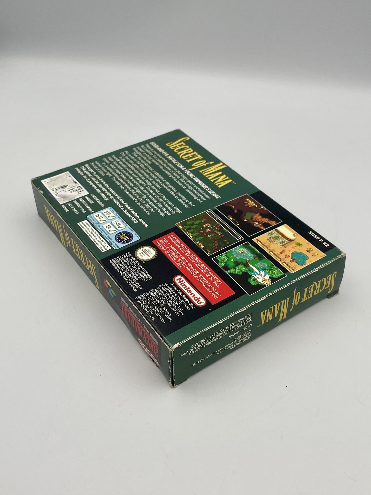Box of 'Secret of Mana' for the Nintendo Entertainment System on a gray background