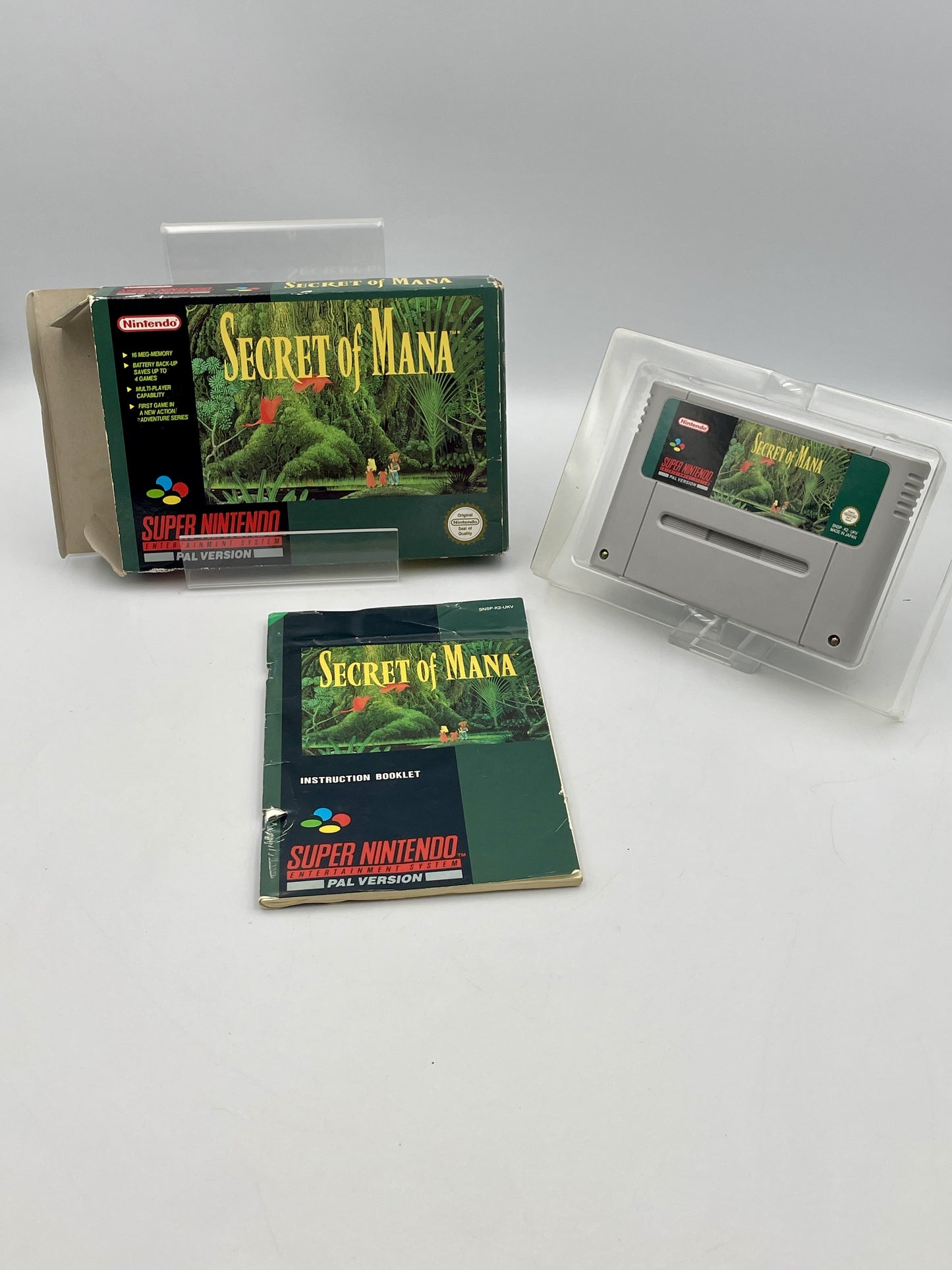 Super Nintendo Entertainment System game 'Secret of Mana' with packaging on a white background