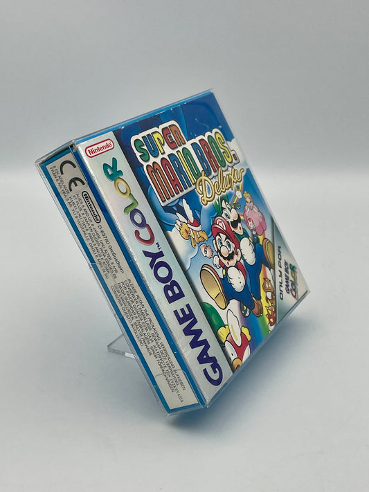 Super Mario Bros. Deluxe Game Boy Color packaging on a gray background