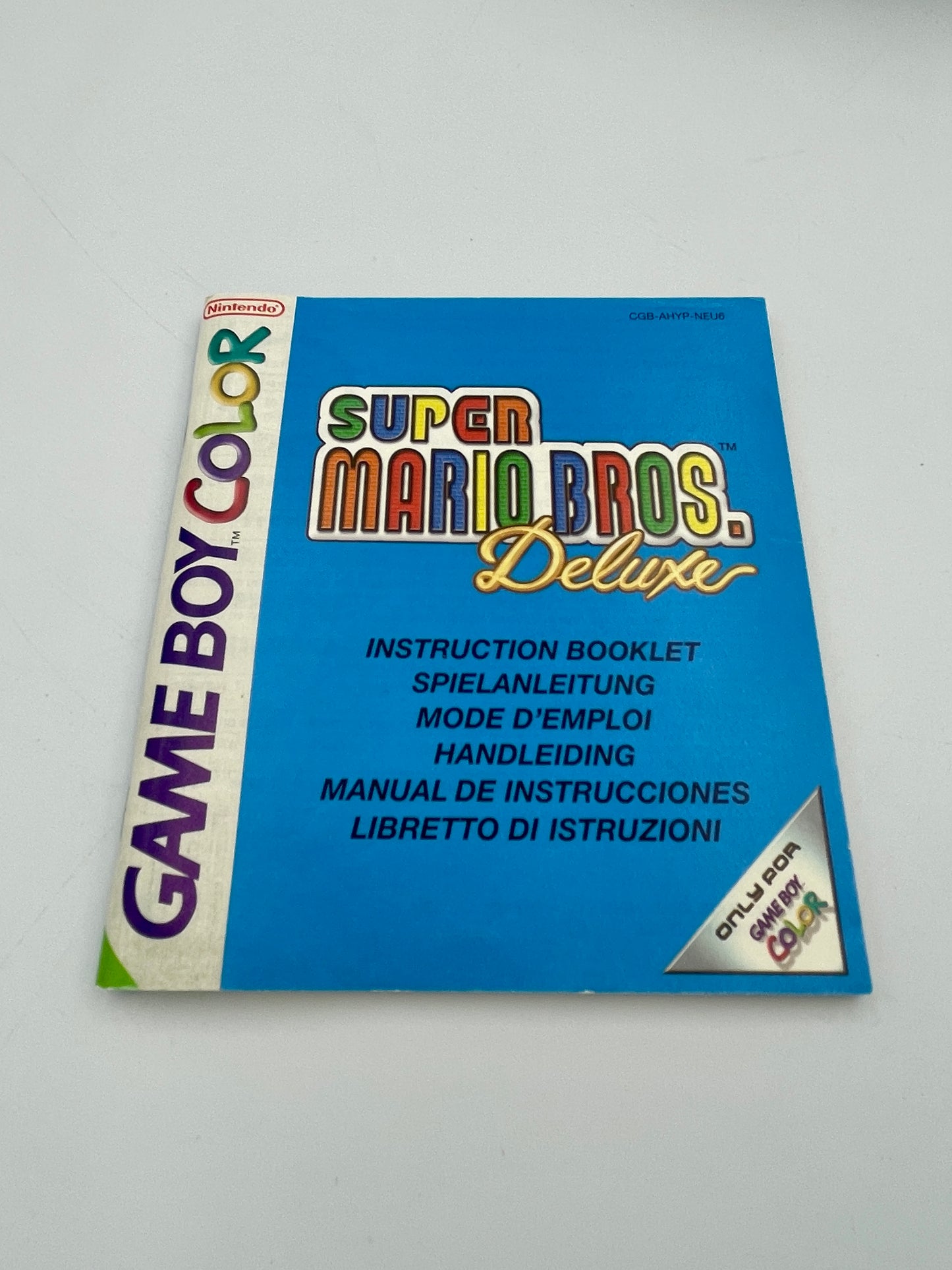 Super Mario Bros. Deluxe Game Boy Color instruction booklet on a white background