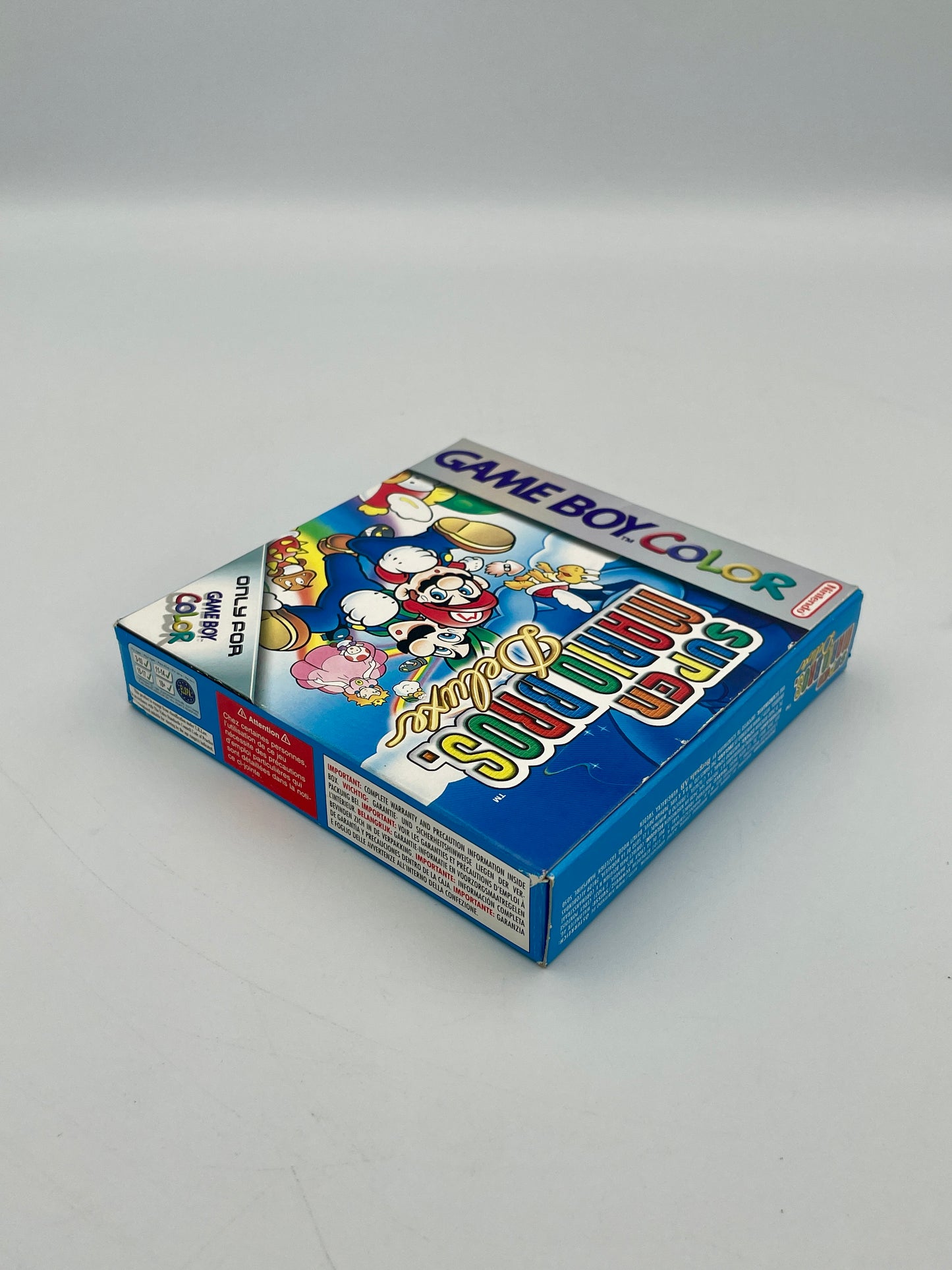 Game Boy Color game cartridge packaging on a gray background