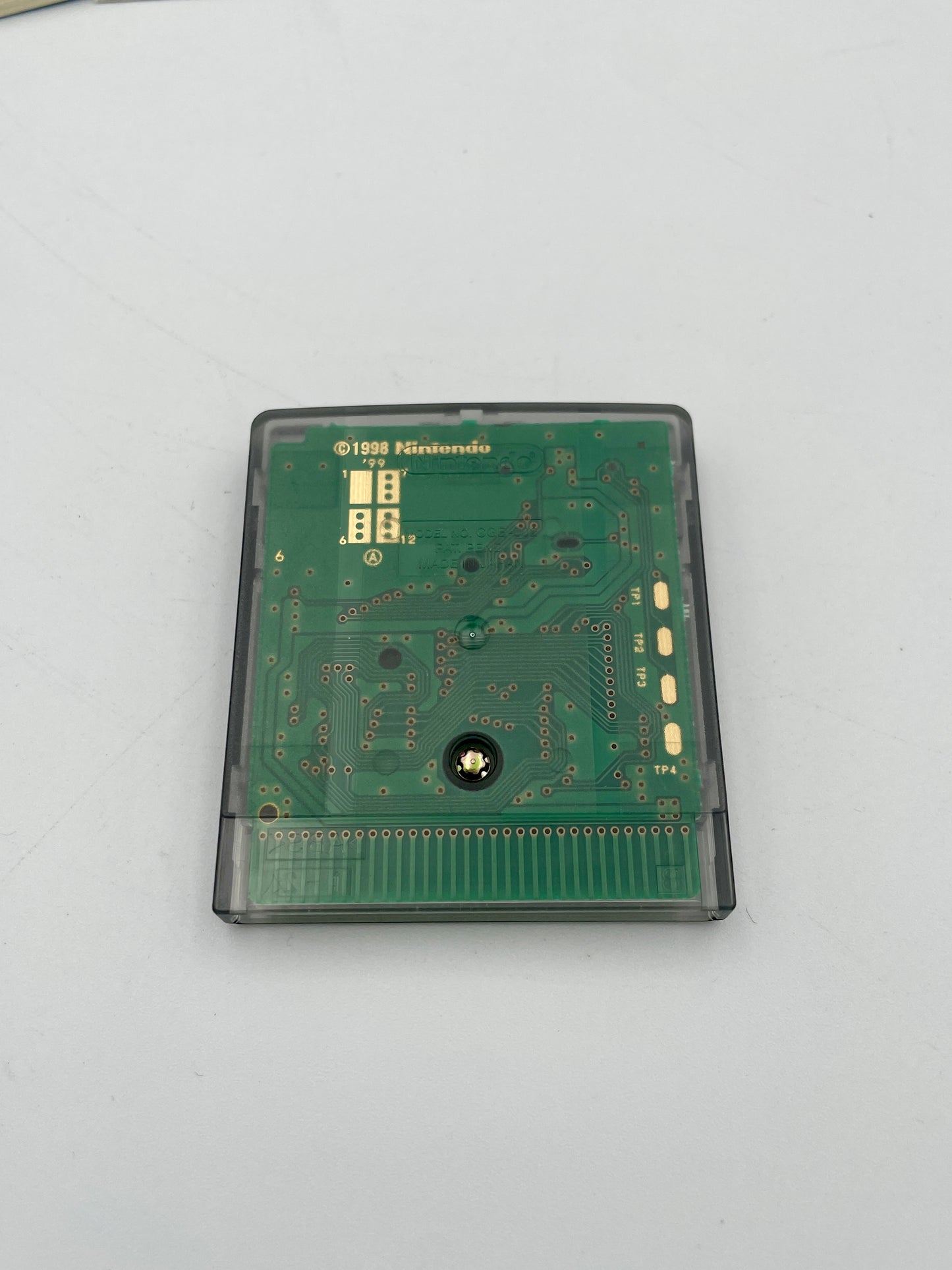 Green electronic circuit board on a white background