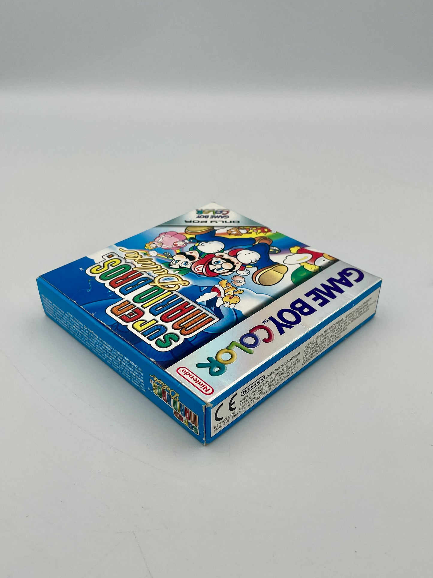 Game Boy Color packaging with colorful graphics on a gray background