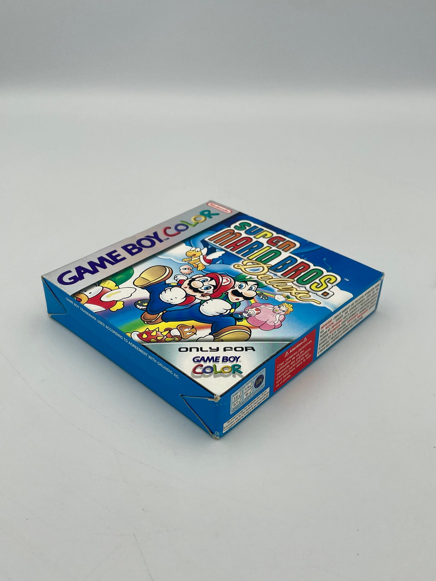 Super Mario World Game Boy Color packaging on a white background