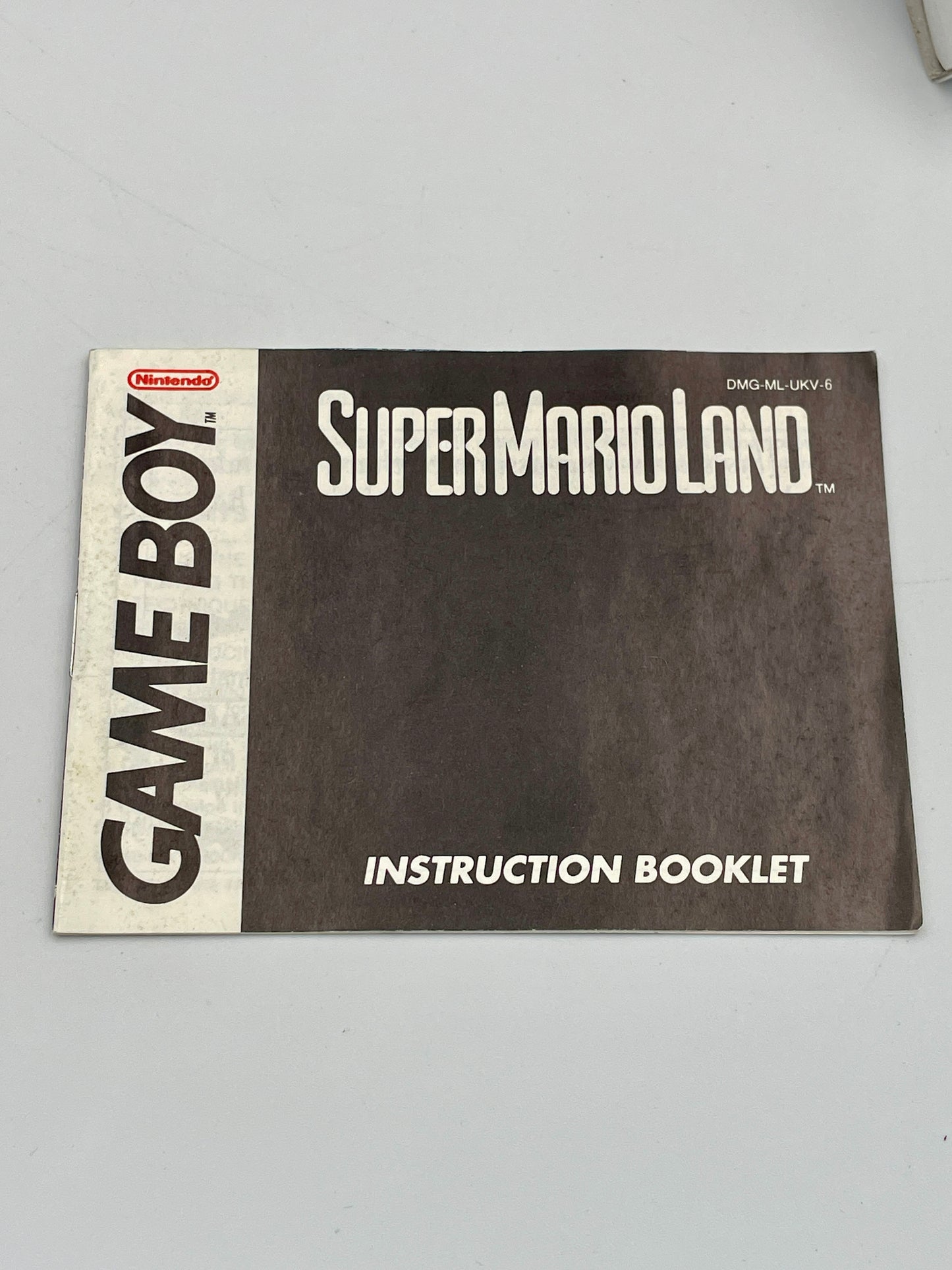 Instruction booklet for Super Mario Land Game Boy on a light gray background