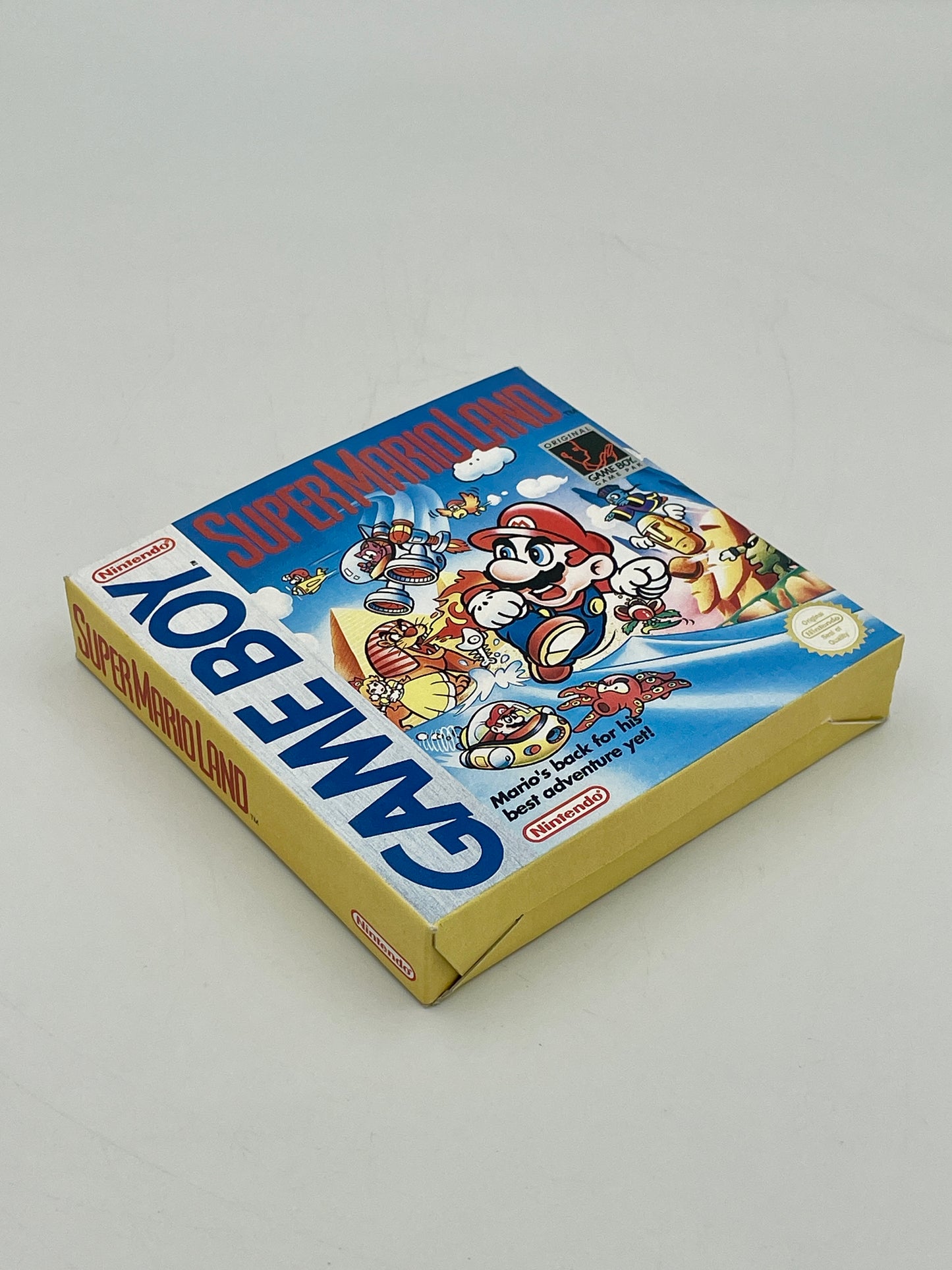 Super Mario Land Game Boy packaging on a light gray background