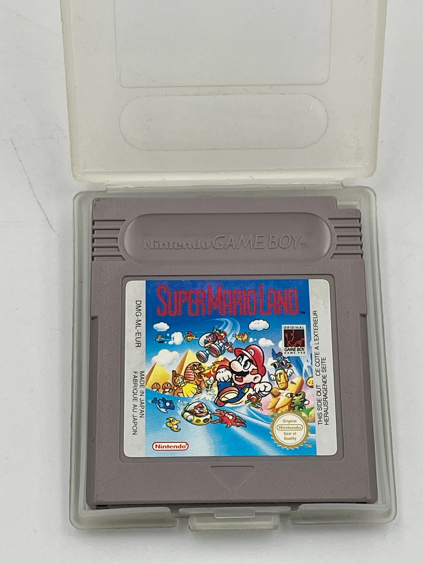 Super Mario Land game cartridge in a clear case on a white background