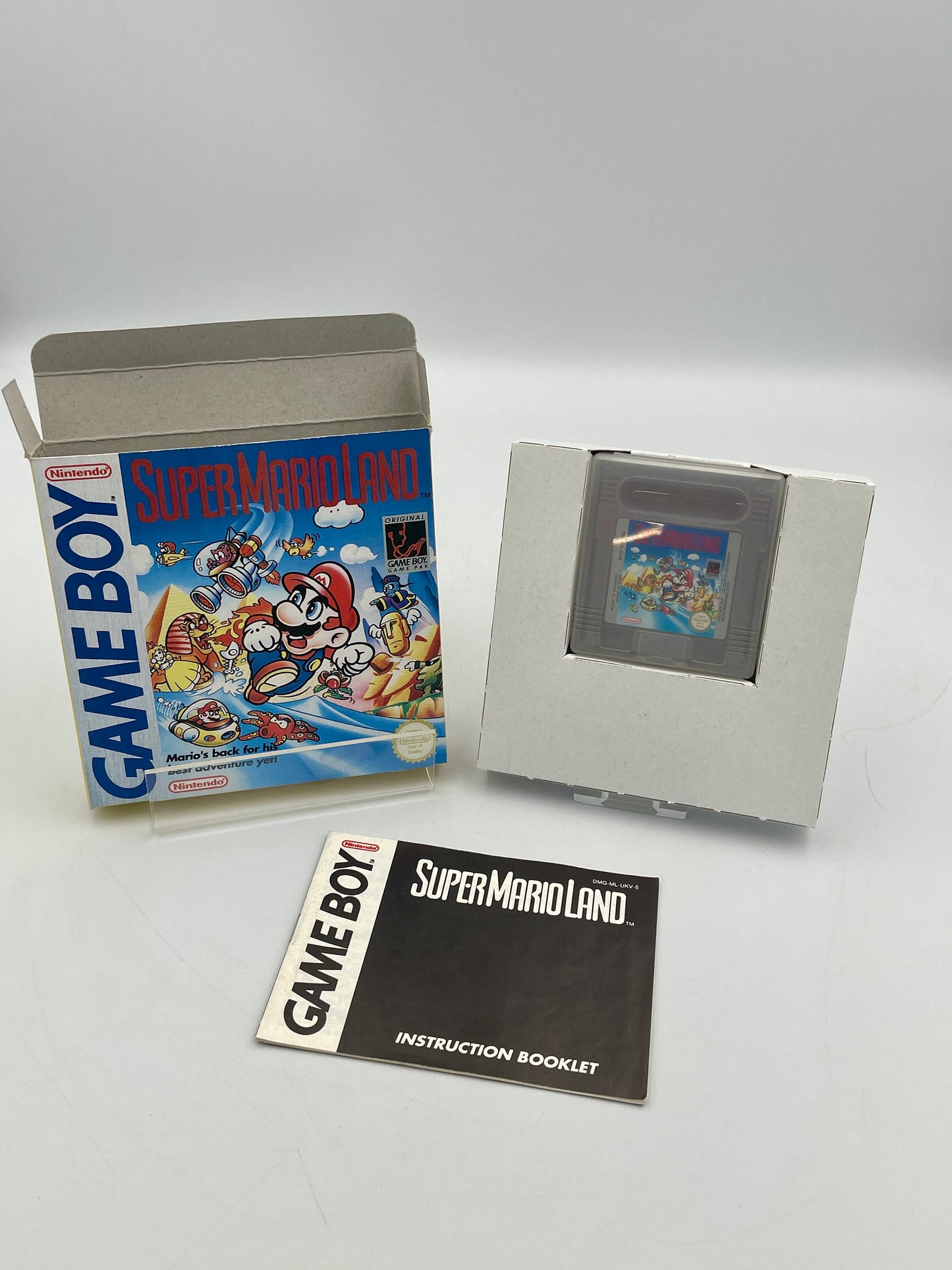 Super Mario Land Game Boy game cartridge with box and instruction booklet on a white background