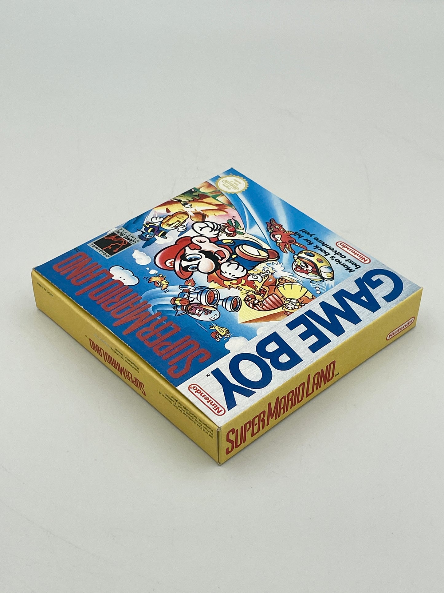 Game Boy cartridge box featuring Super Mario Land on a gray background