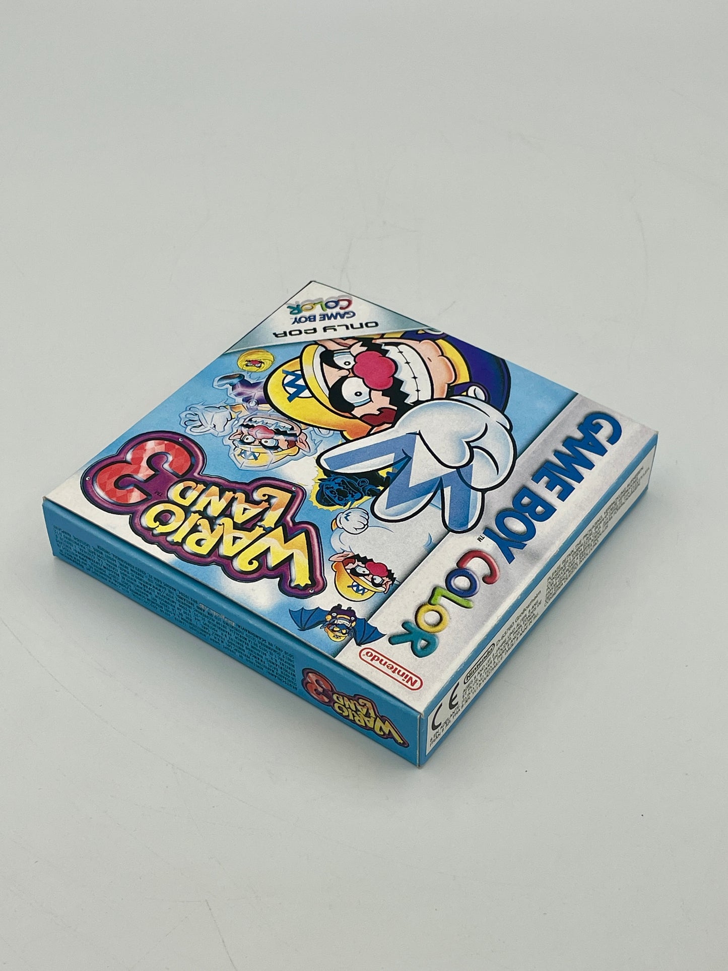 Card game box with cartoon character on a gray background