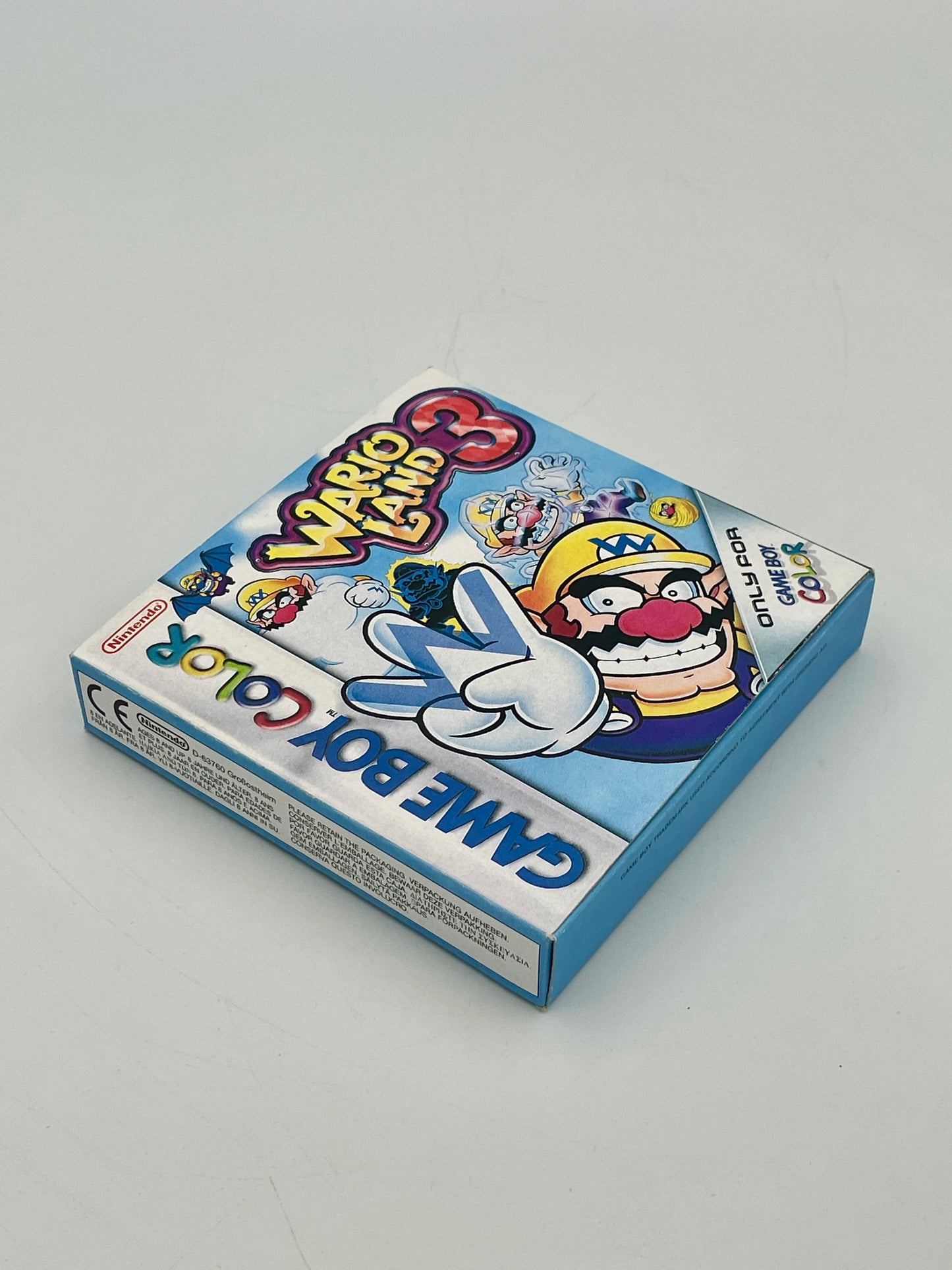 Game Boy Color game case for 'Wario Land 3' on a gray background