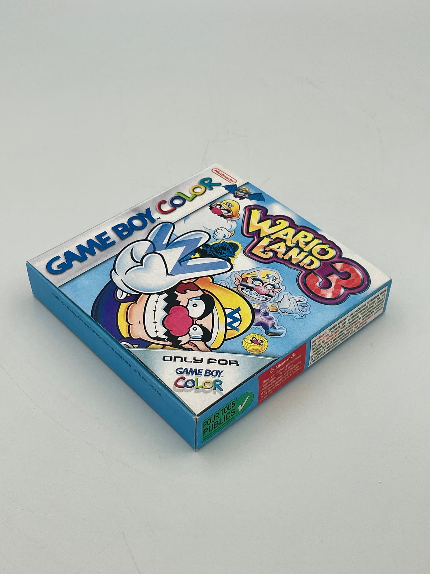 Game Boy Color game case for 'Wario Land 3' on a gray background