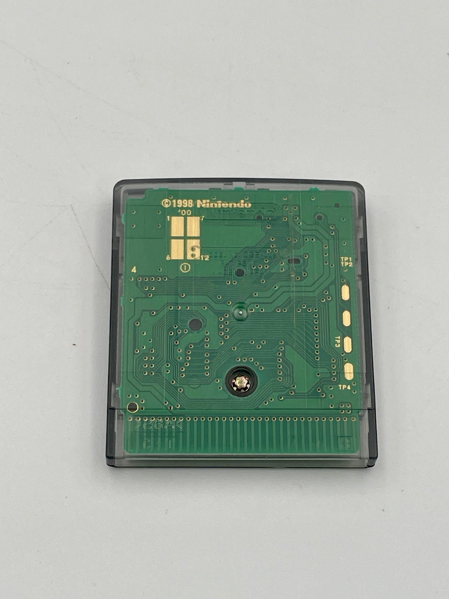 Green Nintendo circuit board on a white background