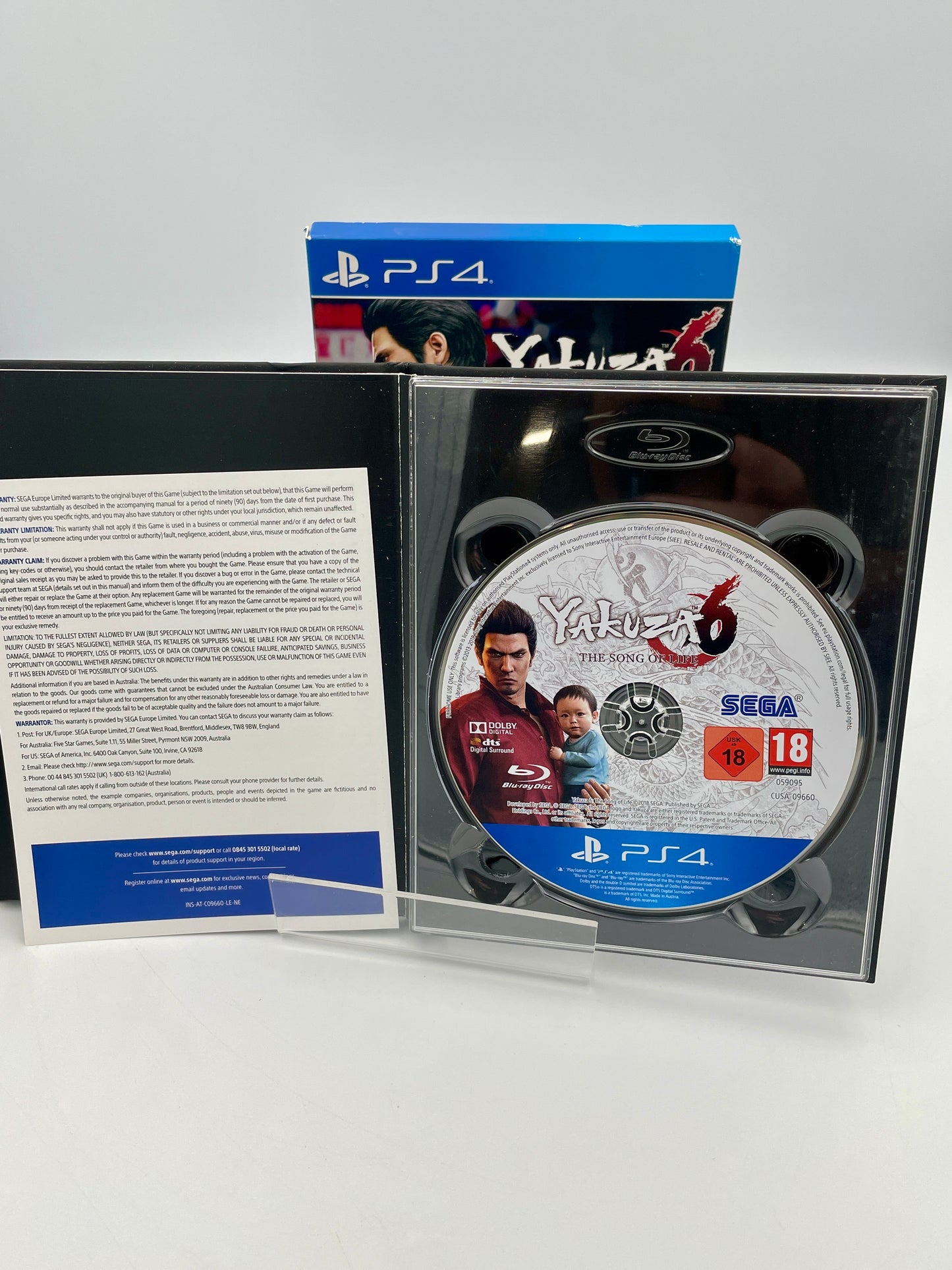 Yakuza 6 PlayStation 4 game disc and case on a white background