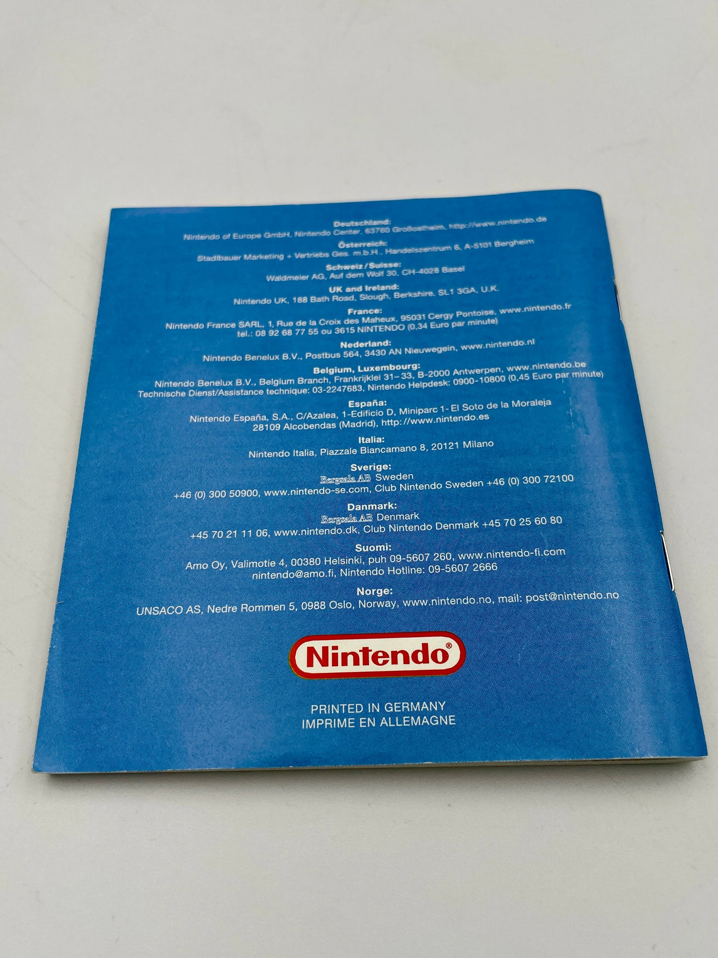 Blue Nintendo product packaging with text and logo on a white background