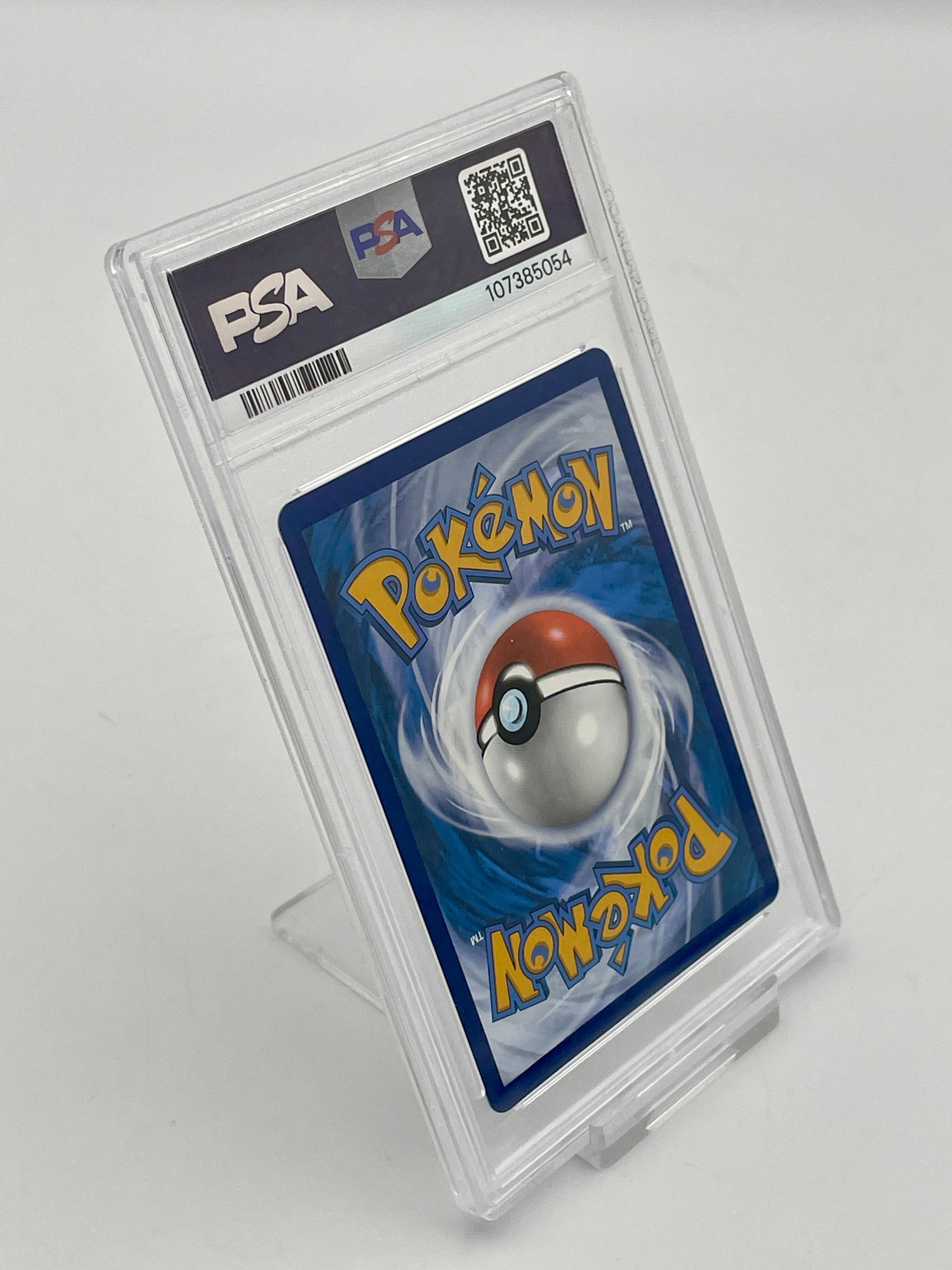 Pokémon trading card in a PSA protective case on a white background