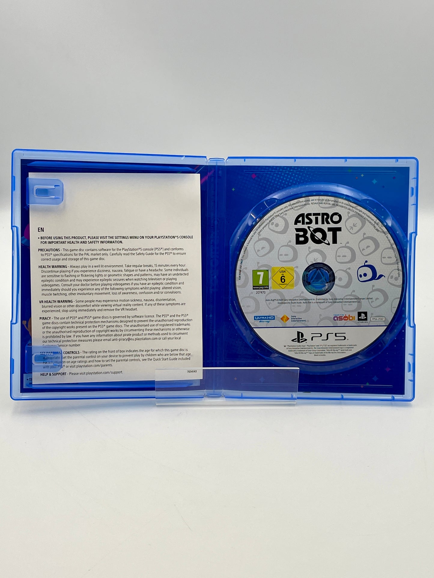 PlayStation 5 game disc in a blue case with 'Astro Bot' branding.