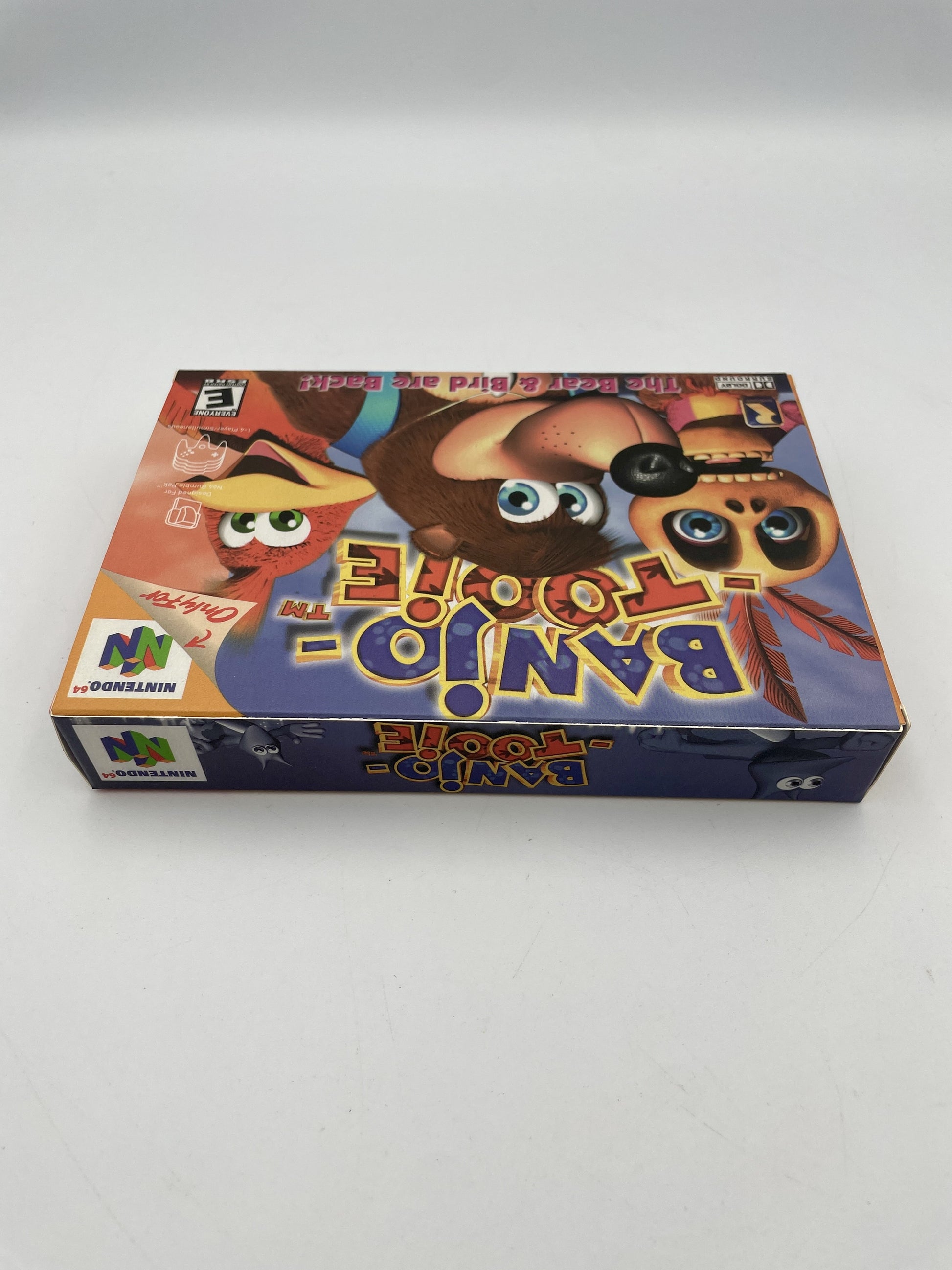 N64 Game Banjo Tooie led flat on white surface
