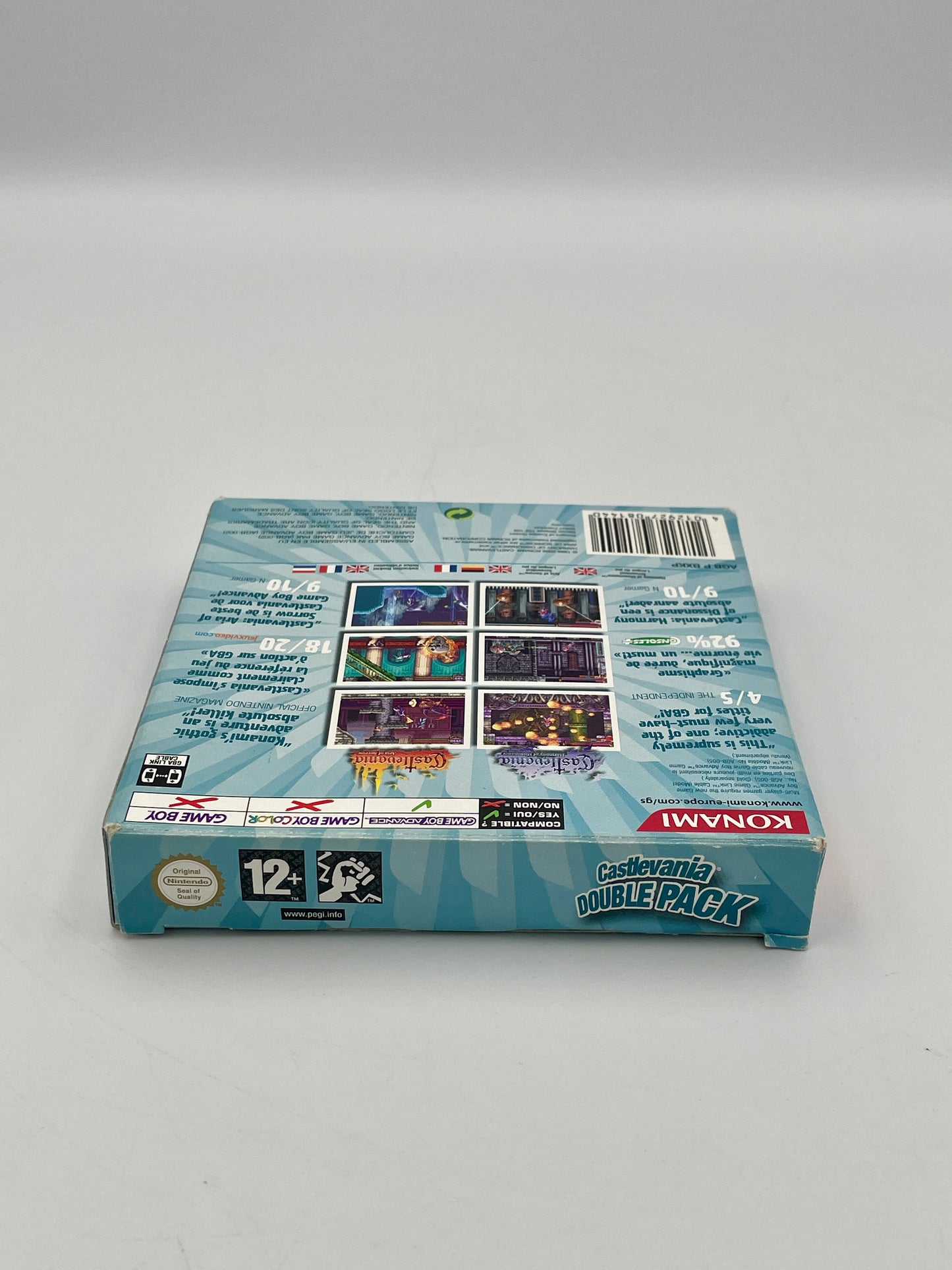 Cardboard game box with Konami branding on a gray background