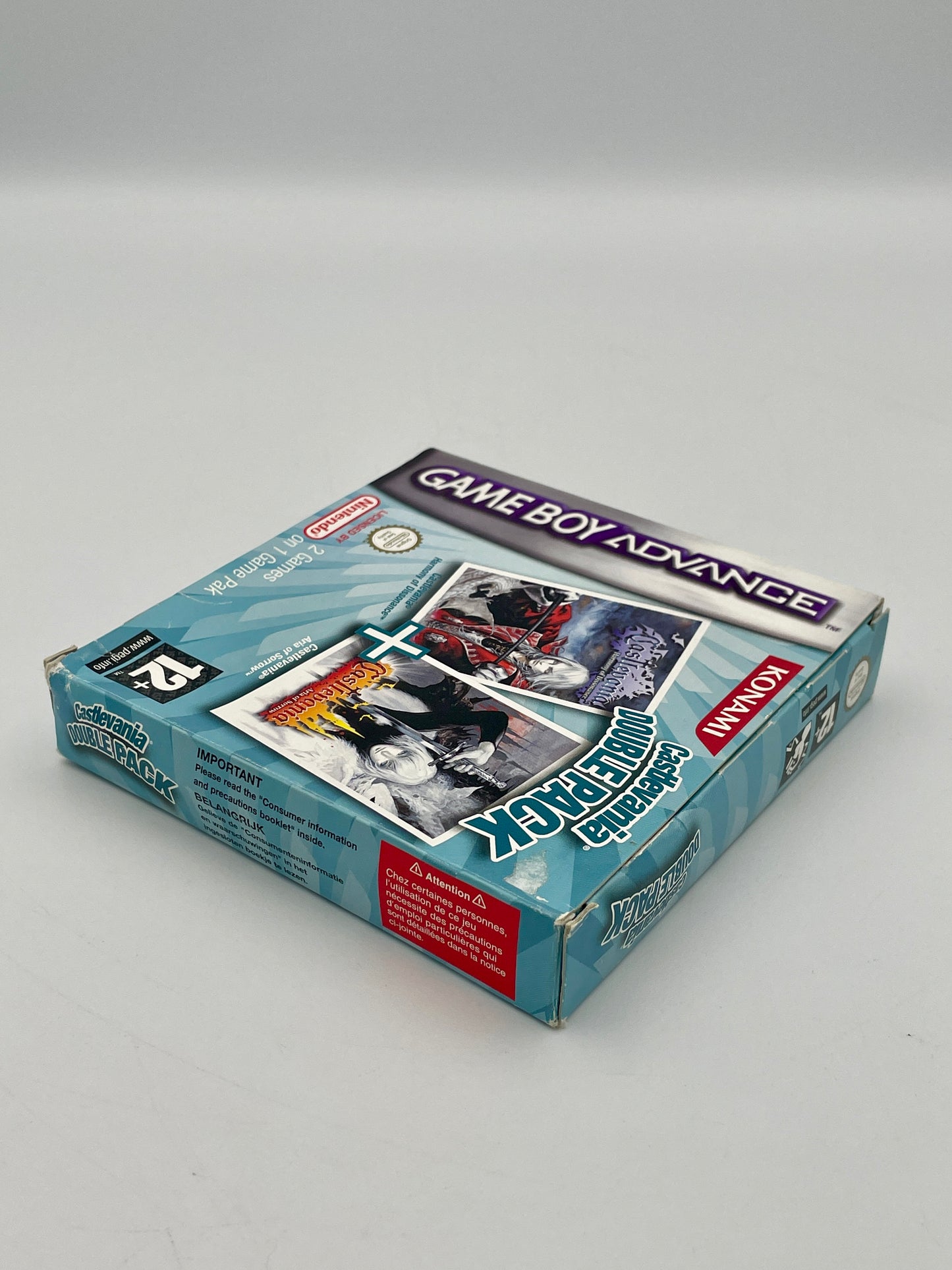 Game Boy Advance packaging with a game case on a gray background