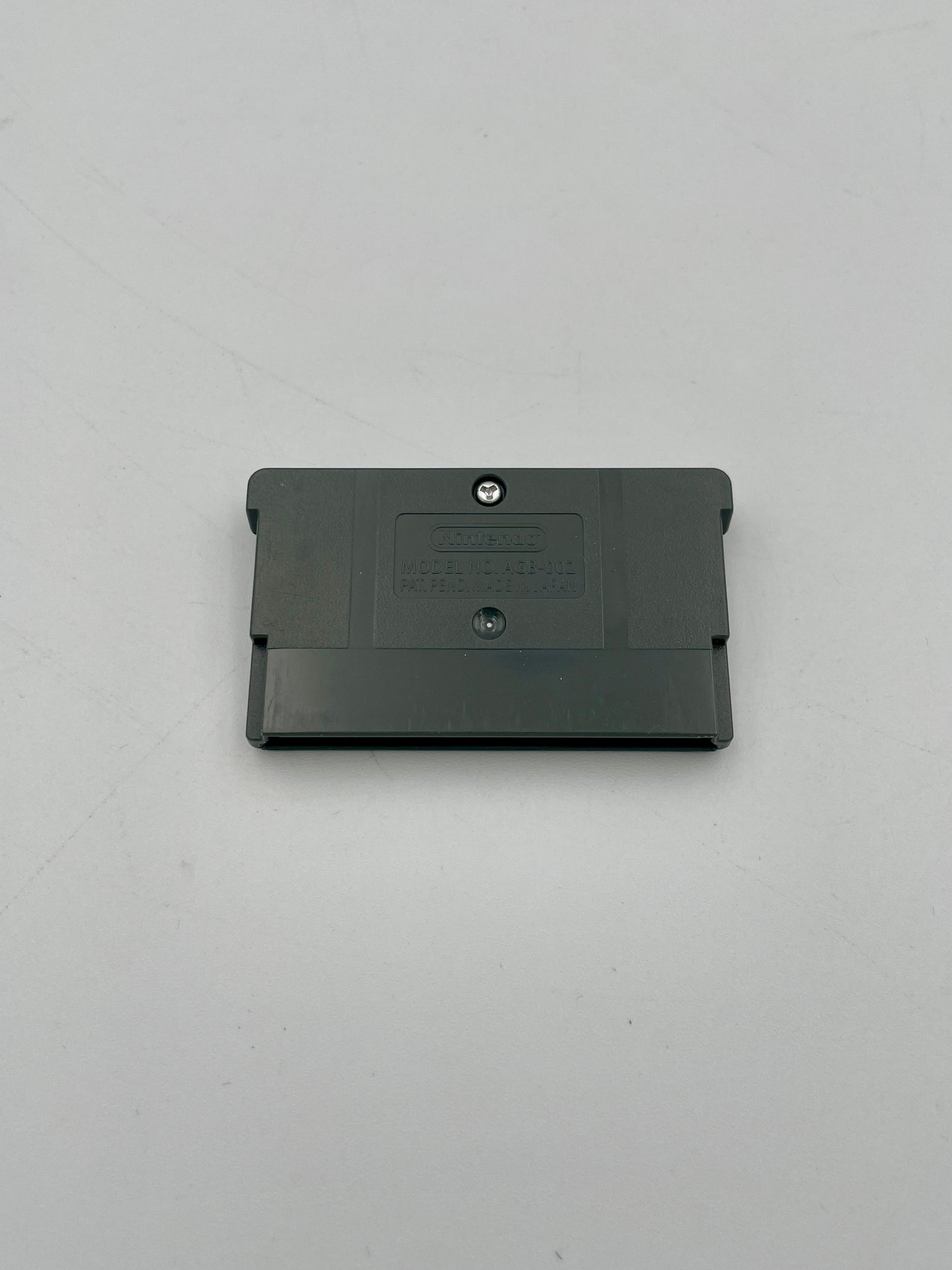 Black rectangular object on a gray background