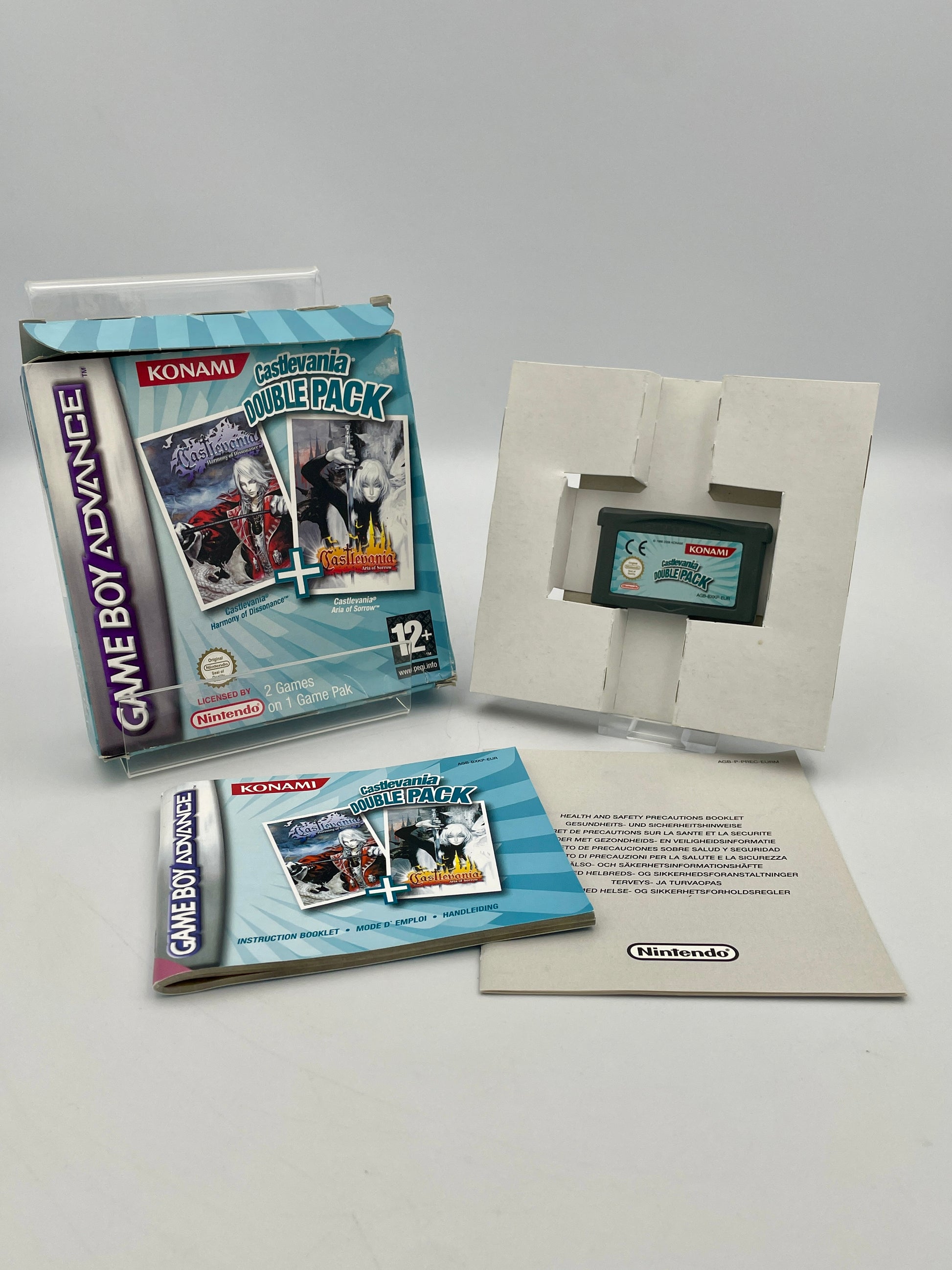 Nintendo Game Boy Advance Konami Double Pack with two games and a manual on a white background