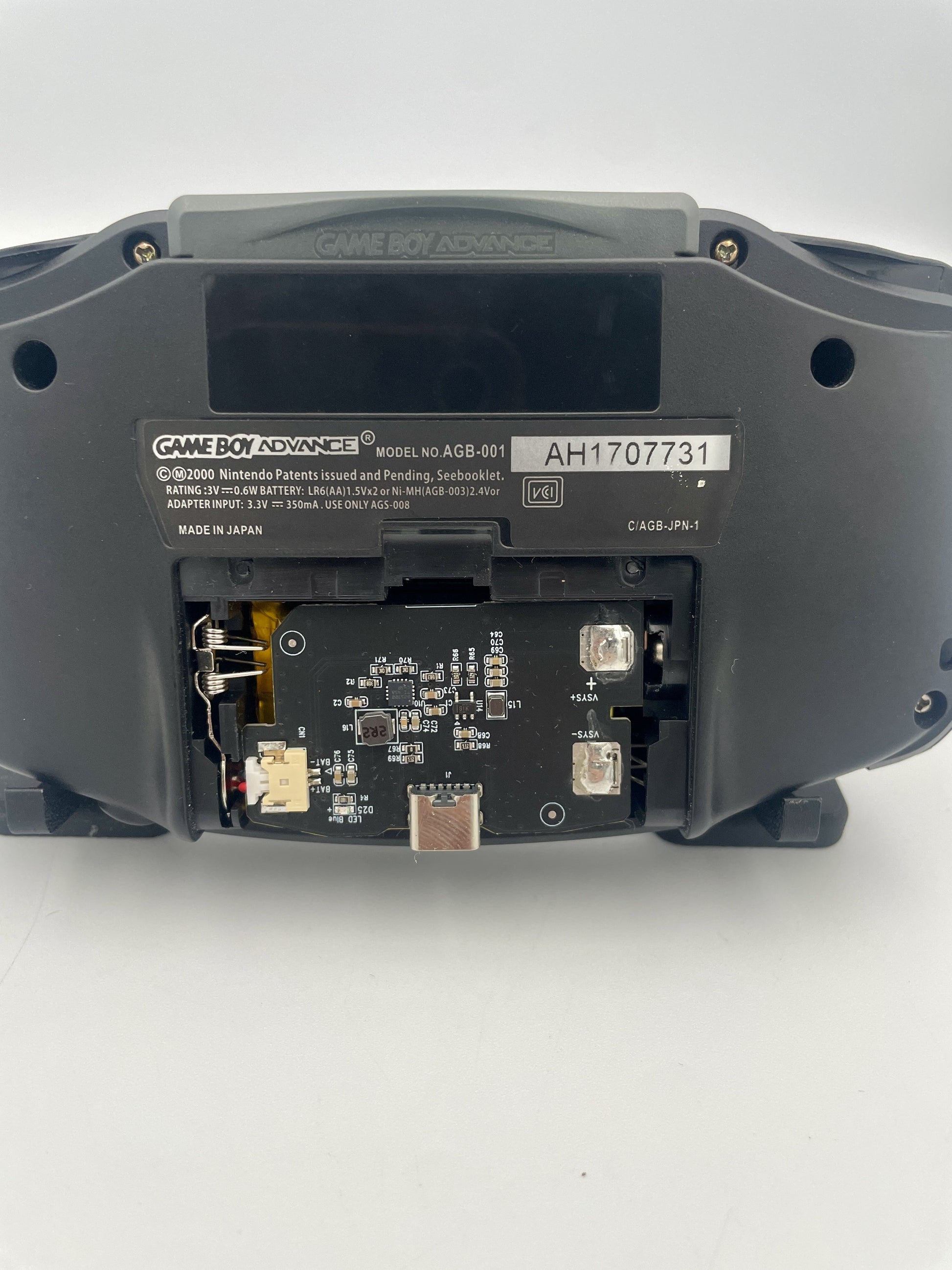Back view of a Game Boy Advance console on a white background