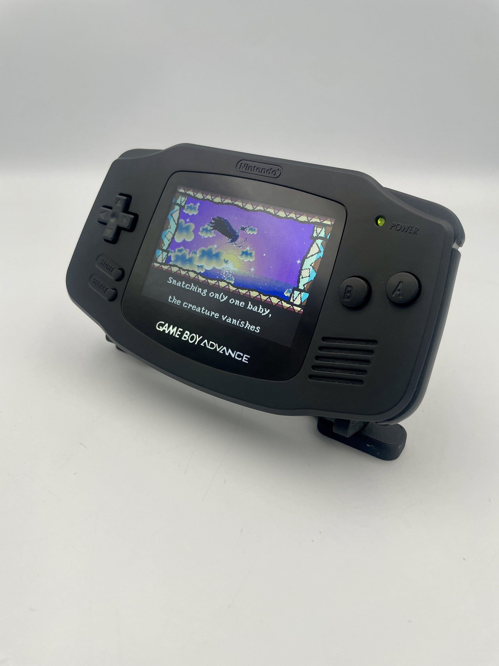 Black Game Boy Advance console on a white background