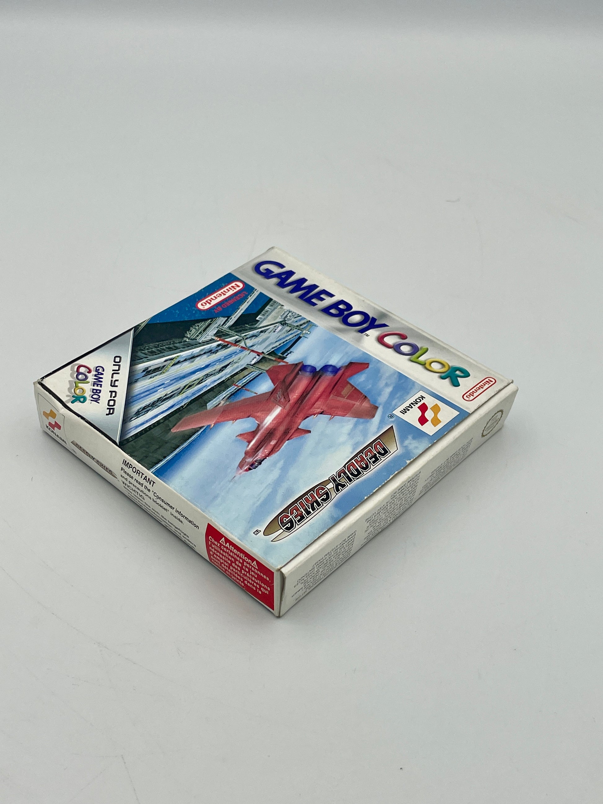 Game Boy Color game cartridge with a red airplane on the cover against a blue sky.