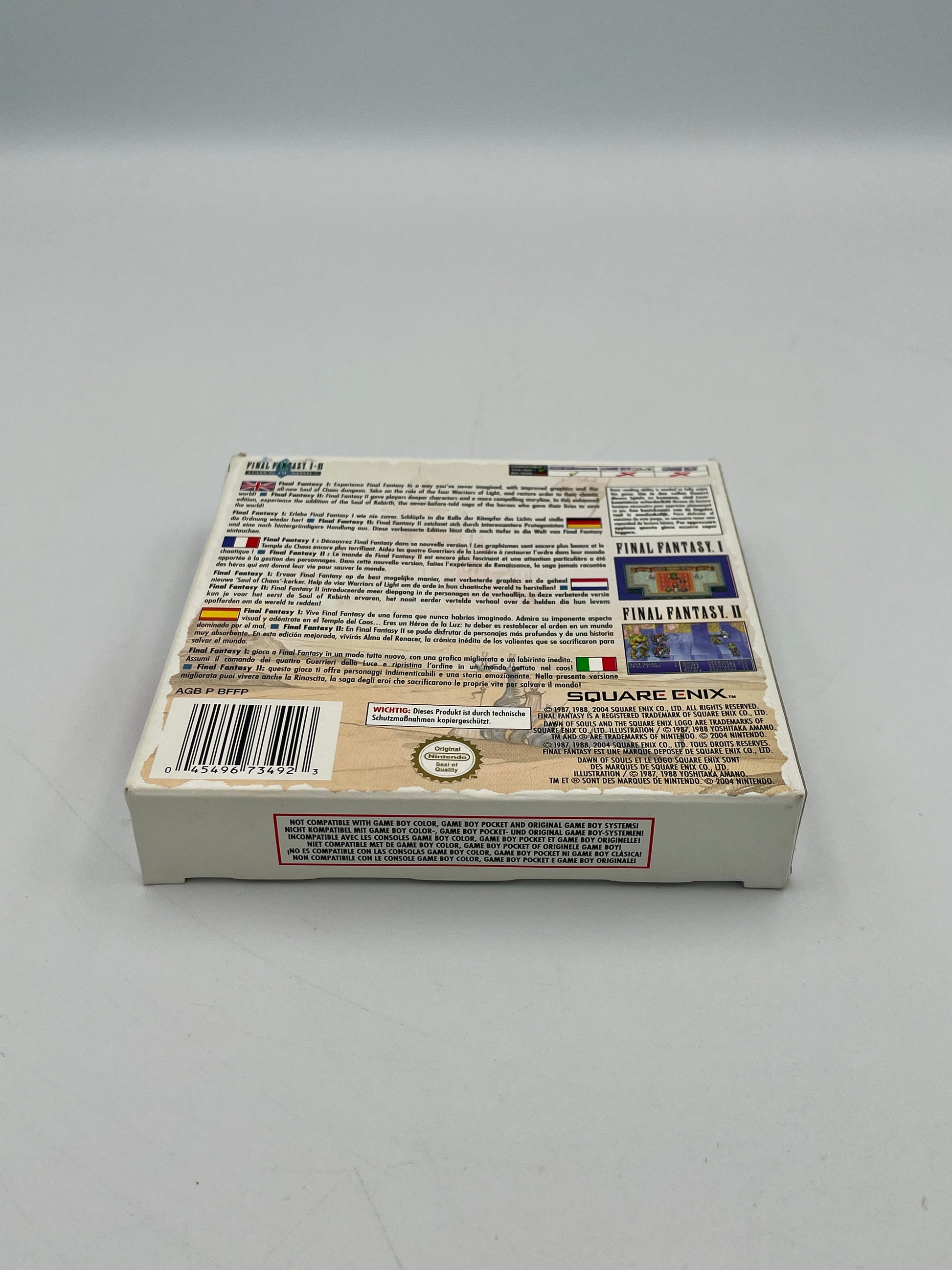 Back of a video game case with text and logos on a gray background